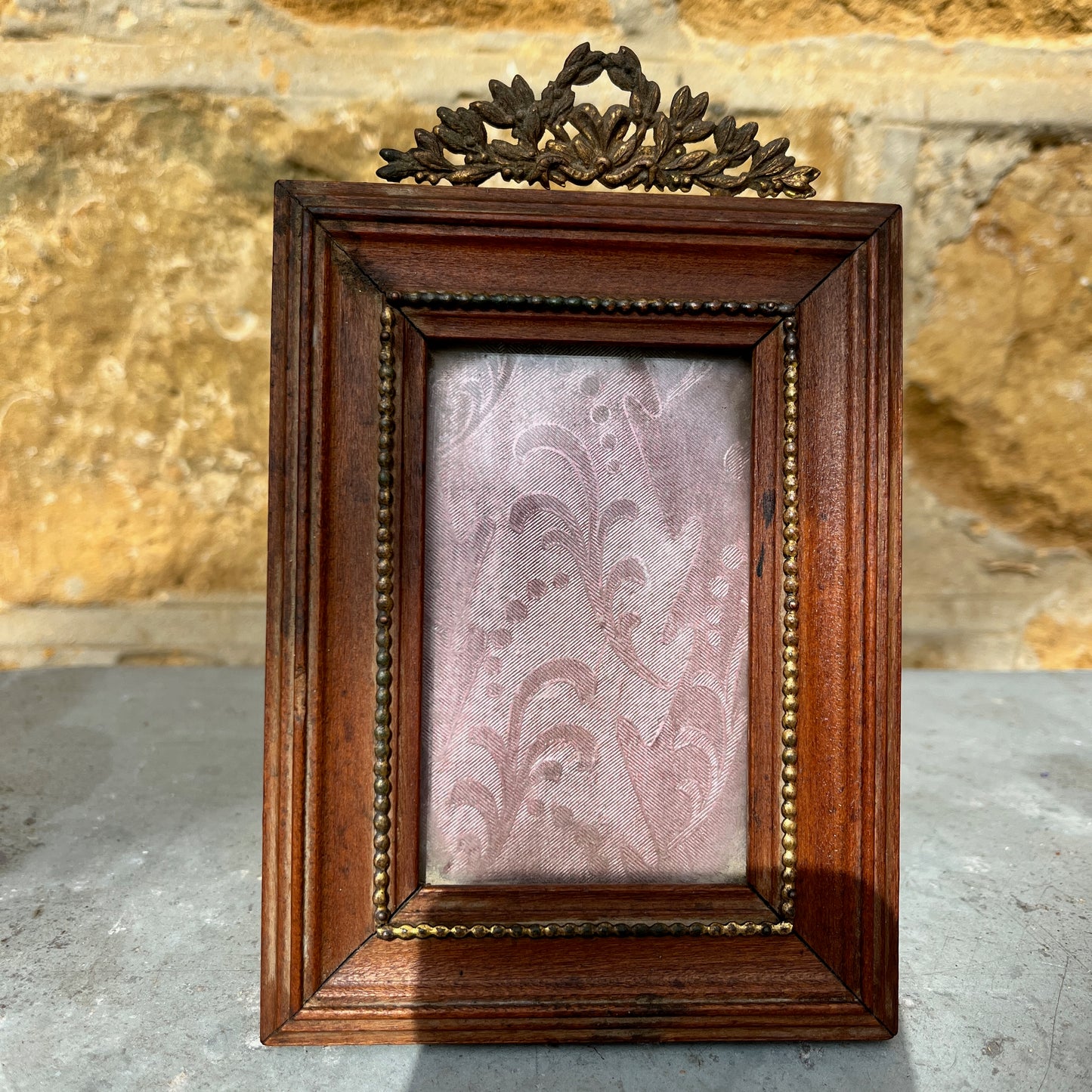 French vintage picture frames, both with silk interiors, and decorative frames; one wooden with delicate beading the other white with gold edging