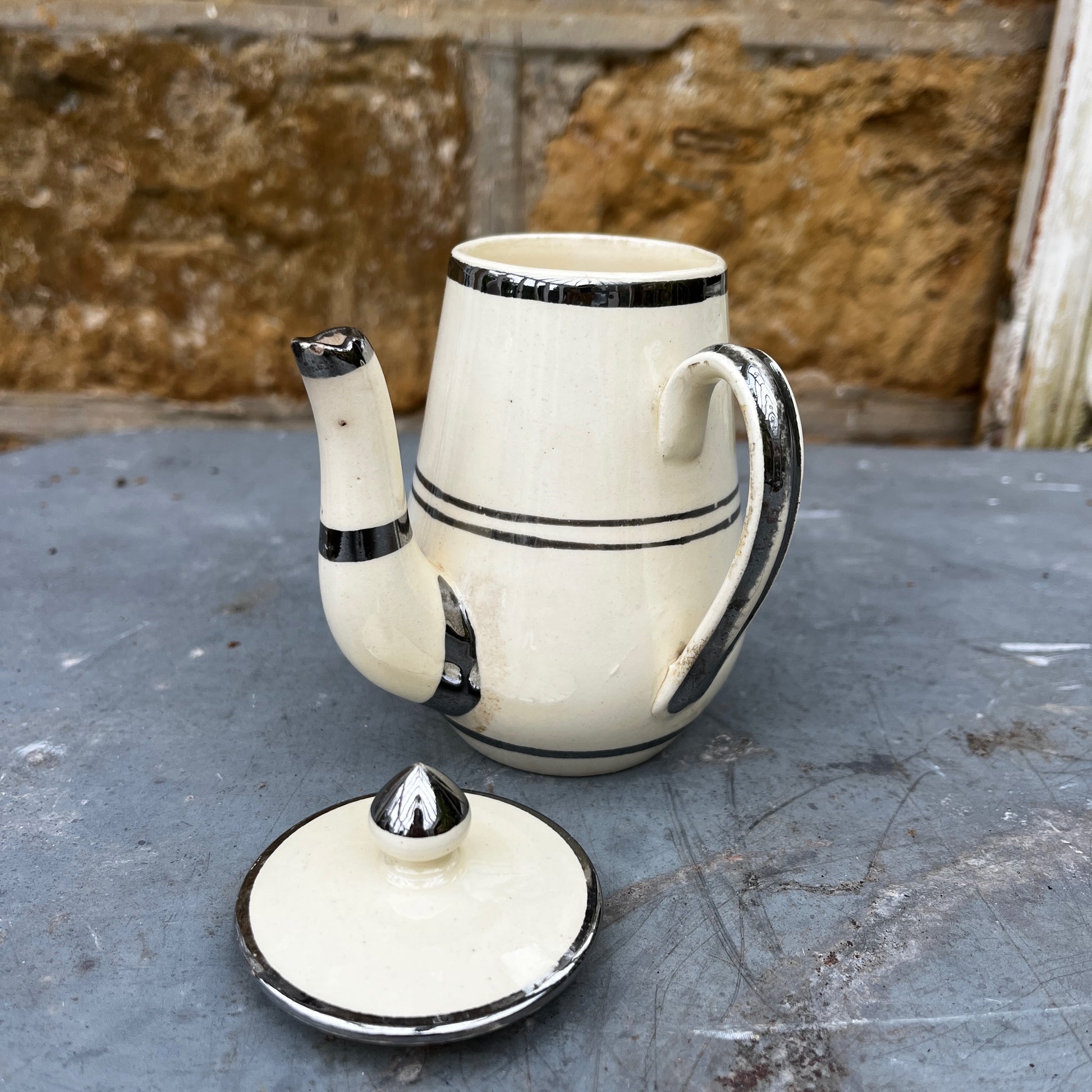 Cream-colored vintage French pot featuring delicate gilded detailing around the rim. The pot has a classic, rounded shape with a smooth glazed finish, reflecting elegant French country style.