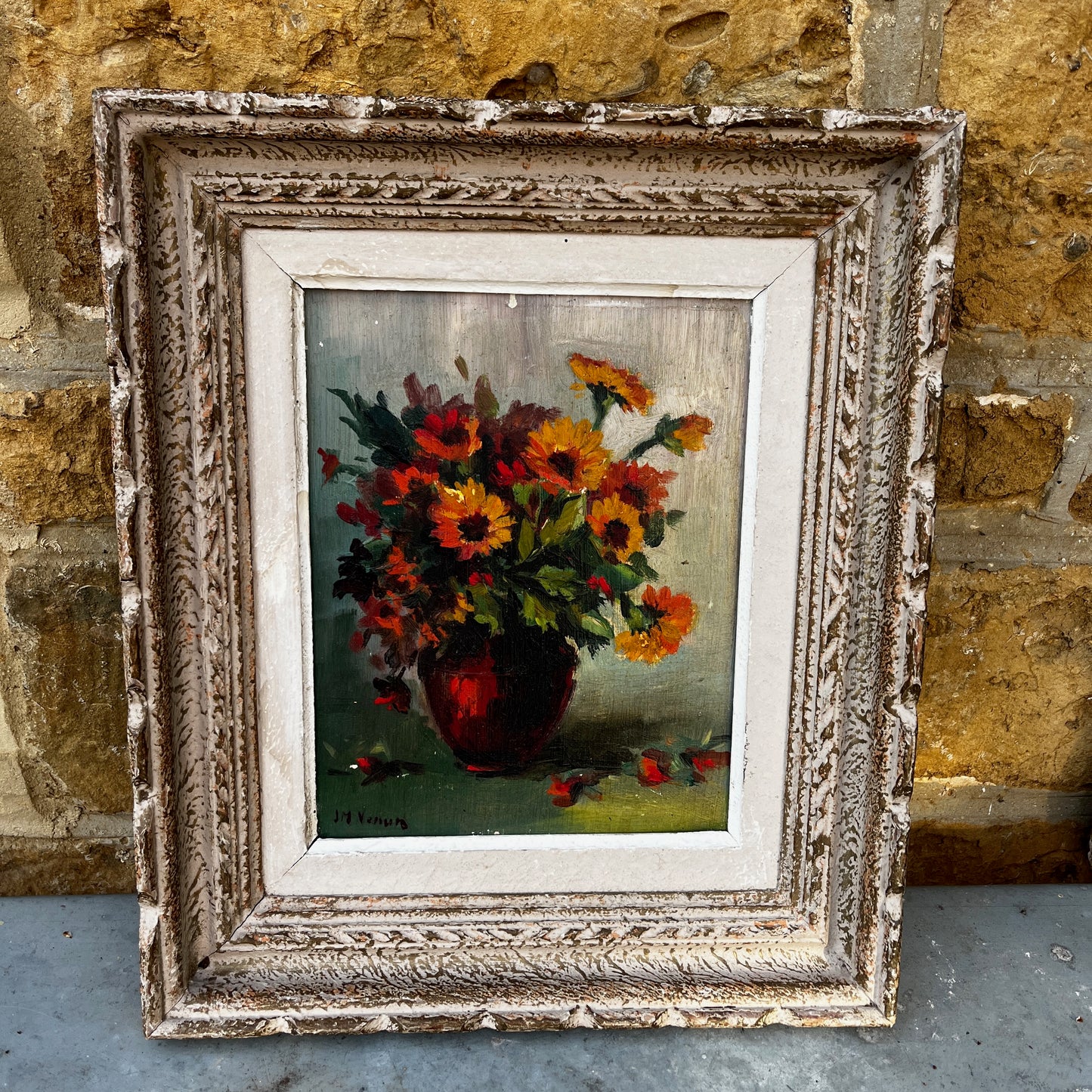 Framed vintage French still life painting of marigolds, featuring warm golden tones and a classic rustic composition in an ornate frame.