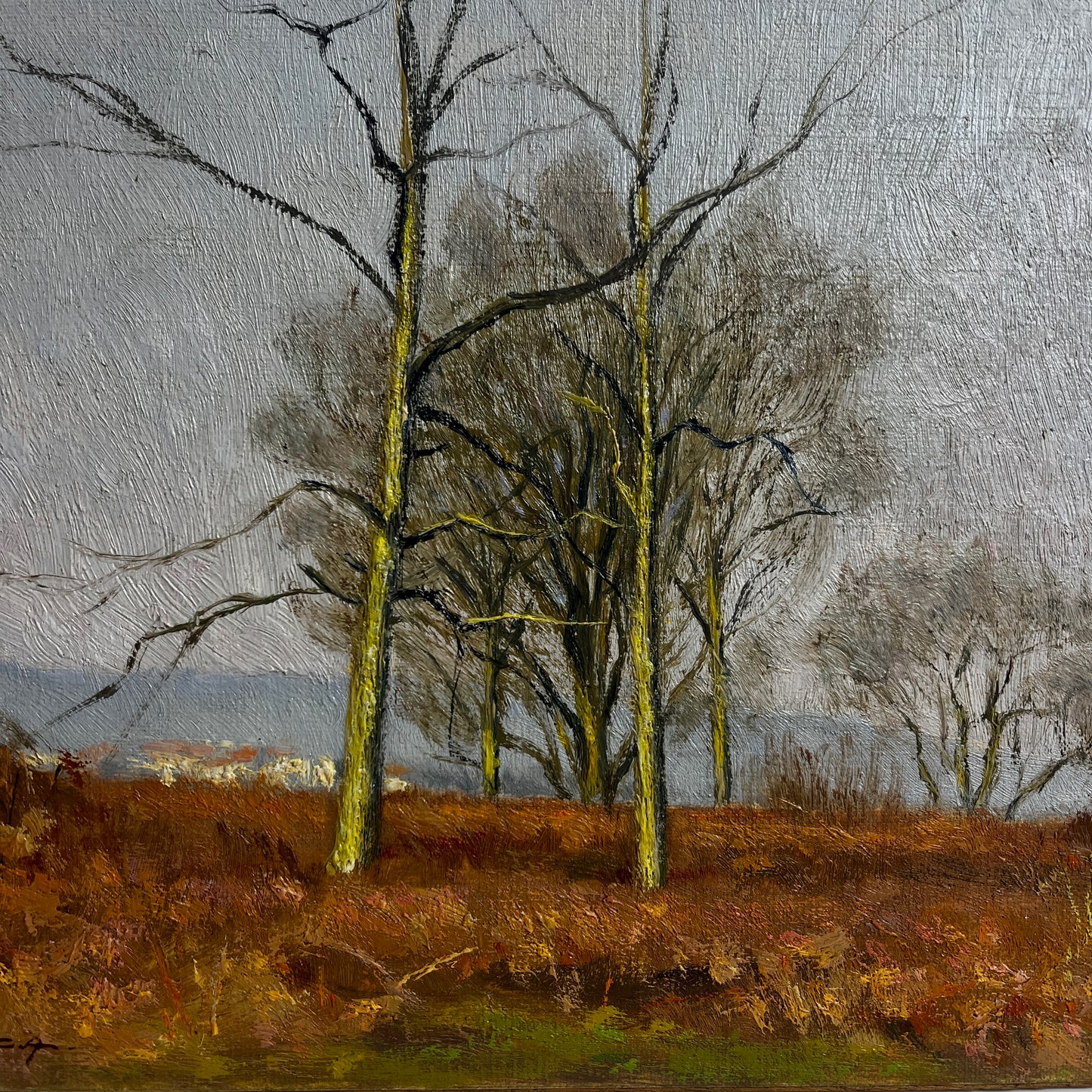 Painting of trees in a field with a gray sky