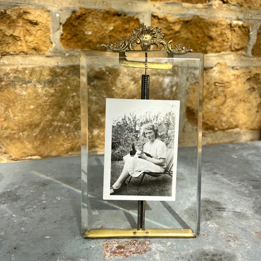 Vintage photo  frame containing a black and white photo of a woman