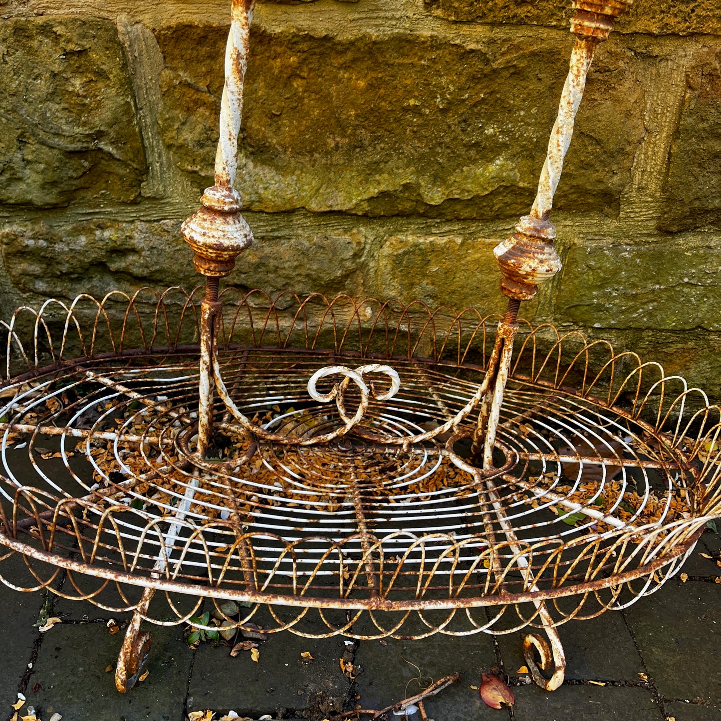 A Vintage Two-Tiered French Wirework Plant Stand with Ornate Detailing