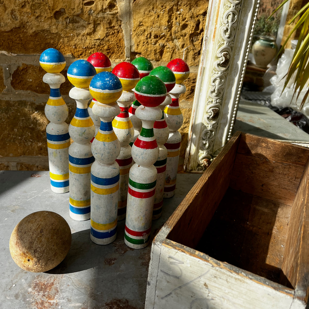 Vintage set of hand-painted French wooden skittles with a matching storage box.