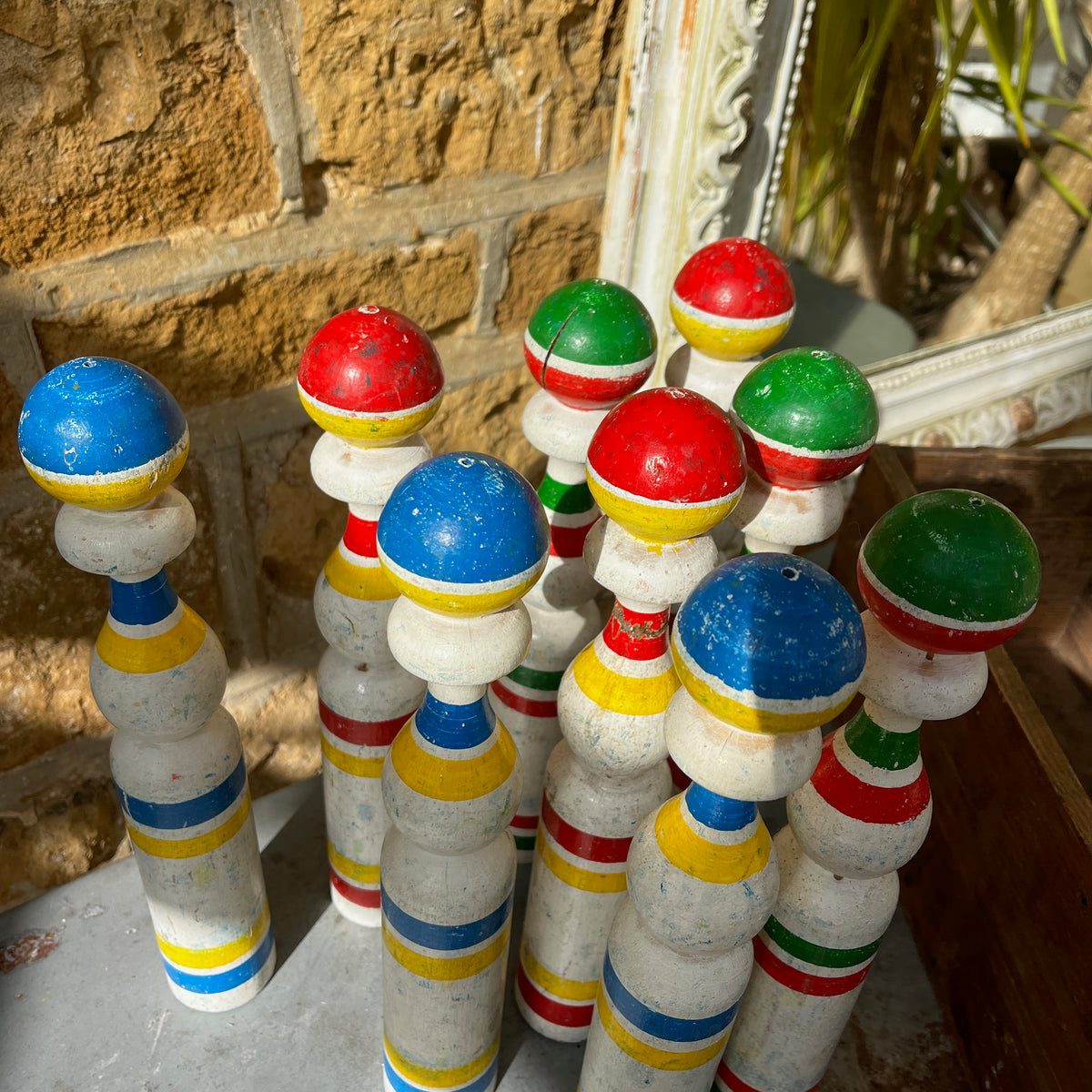 Vintage set of hand-painted French wooden skittles with a matching storage box.