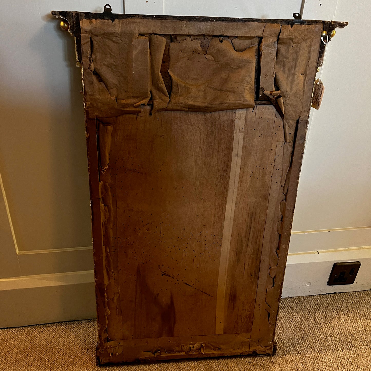 Antique gilded mirror from Grange Manor in Chesterfield, featuring an ornate gold frame with intricate decorative detailing and a richly aged finish.