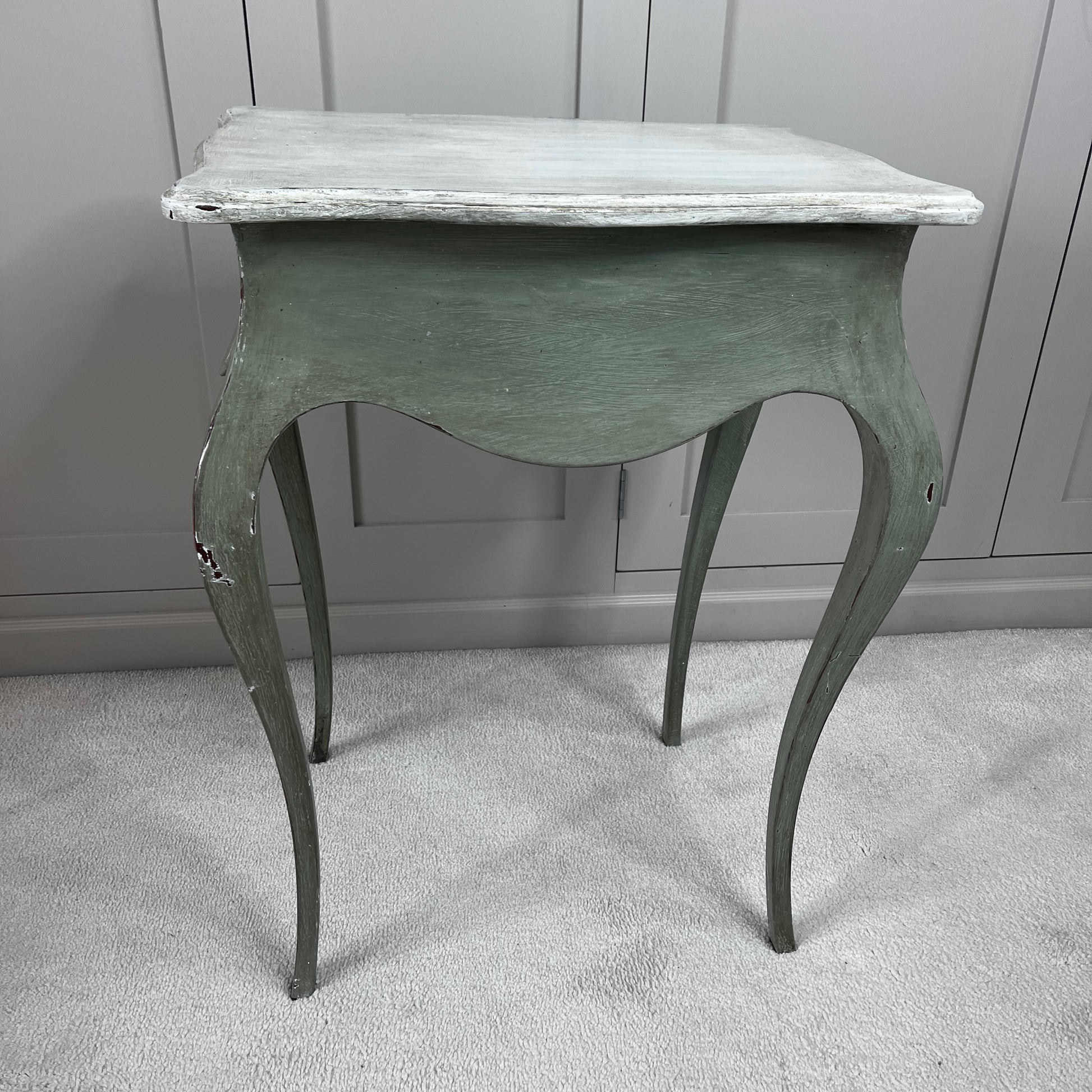 Gustavian-style bedside table with a single drawer, painted green with a contrasting off-white top, featuring simple classical lines and a softly distressed vintage finish.
