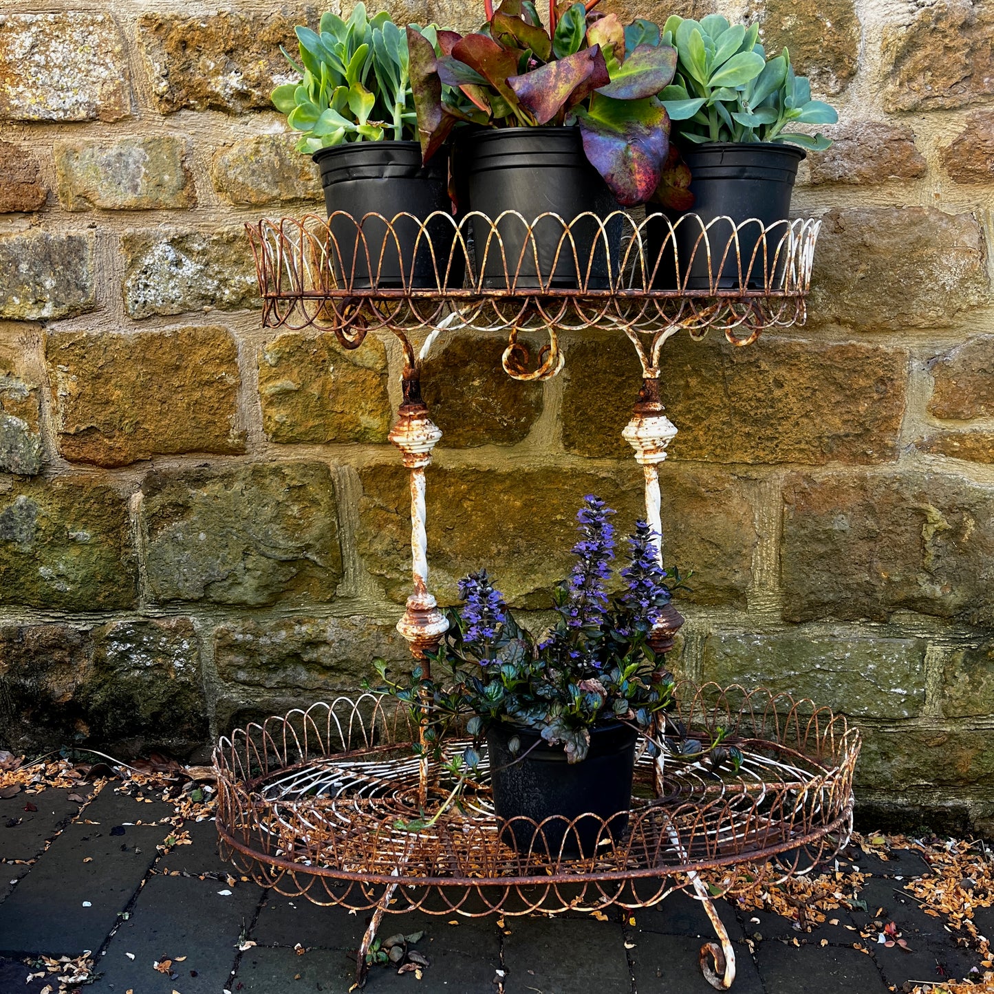 A Vintage Two-Tiered French Wirework Plant Stand with Ornate Detailing