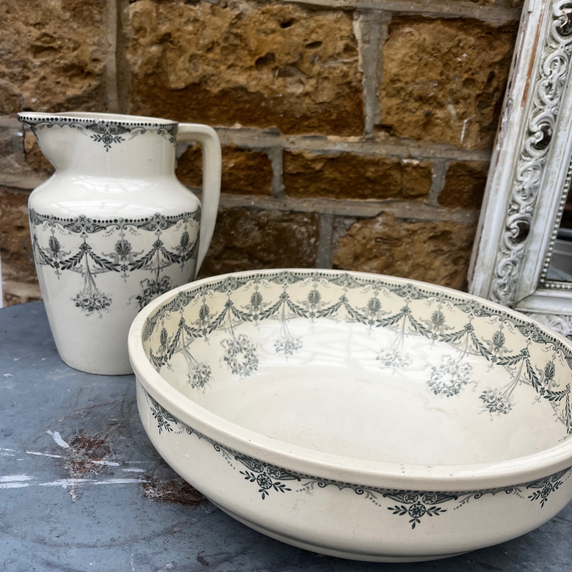 Antique French wash set in green and cream Terre de Fer pottery, stamped HB & Cie Massena, including a basin and jug with classic transferware decoration