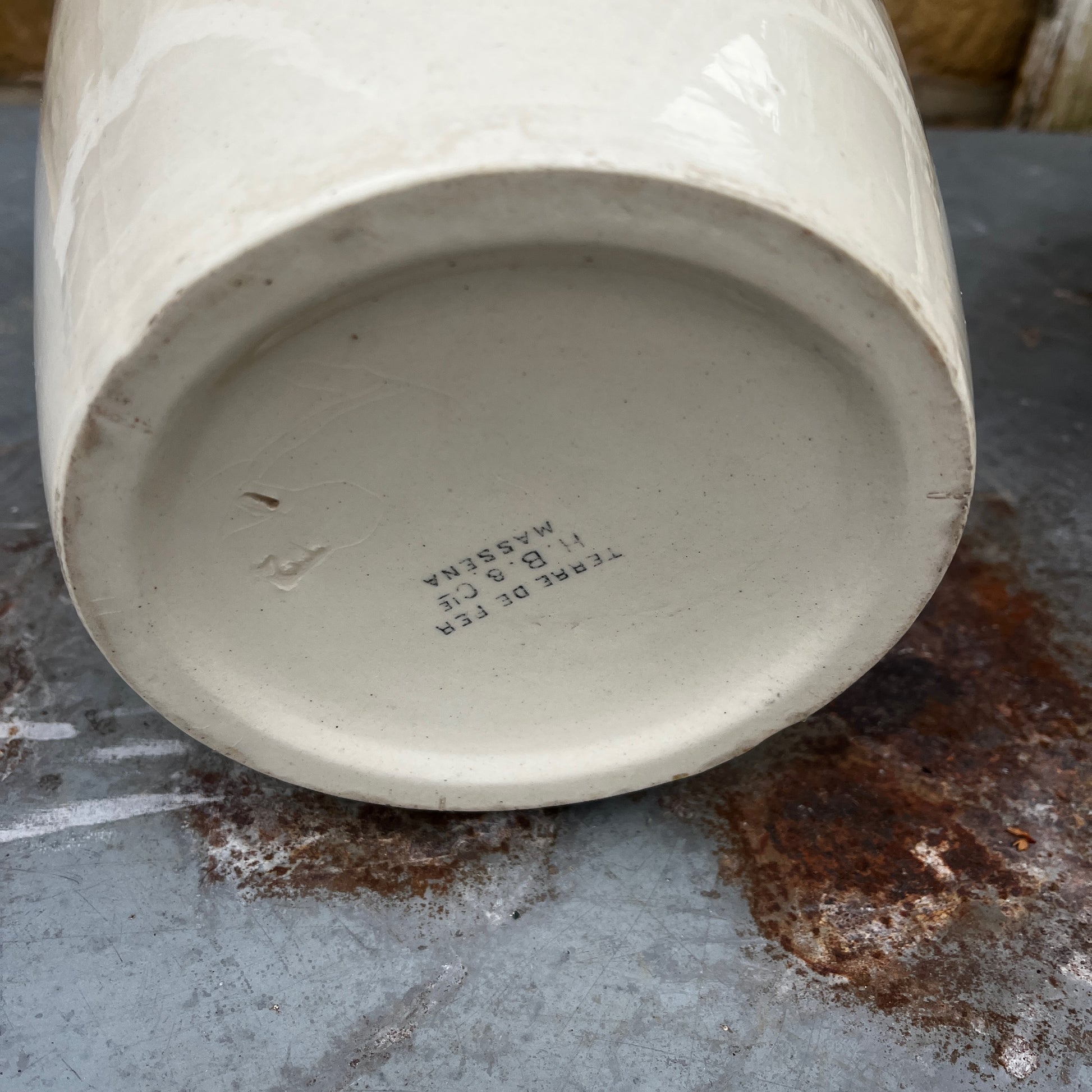 Antique French wash set in green and cream Terre de Fer pottery, stamped HB & Cie Massena, including a basin and jug with classic transferware decoration
