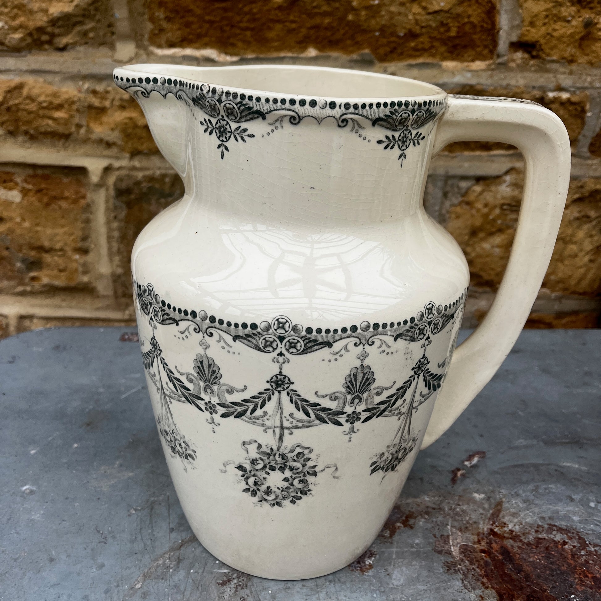 Antique French wash set in green and cream Terre de Fer pottery, stamped HB & Cie Massena, including a basin and jug with classic transferware decoration