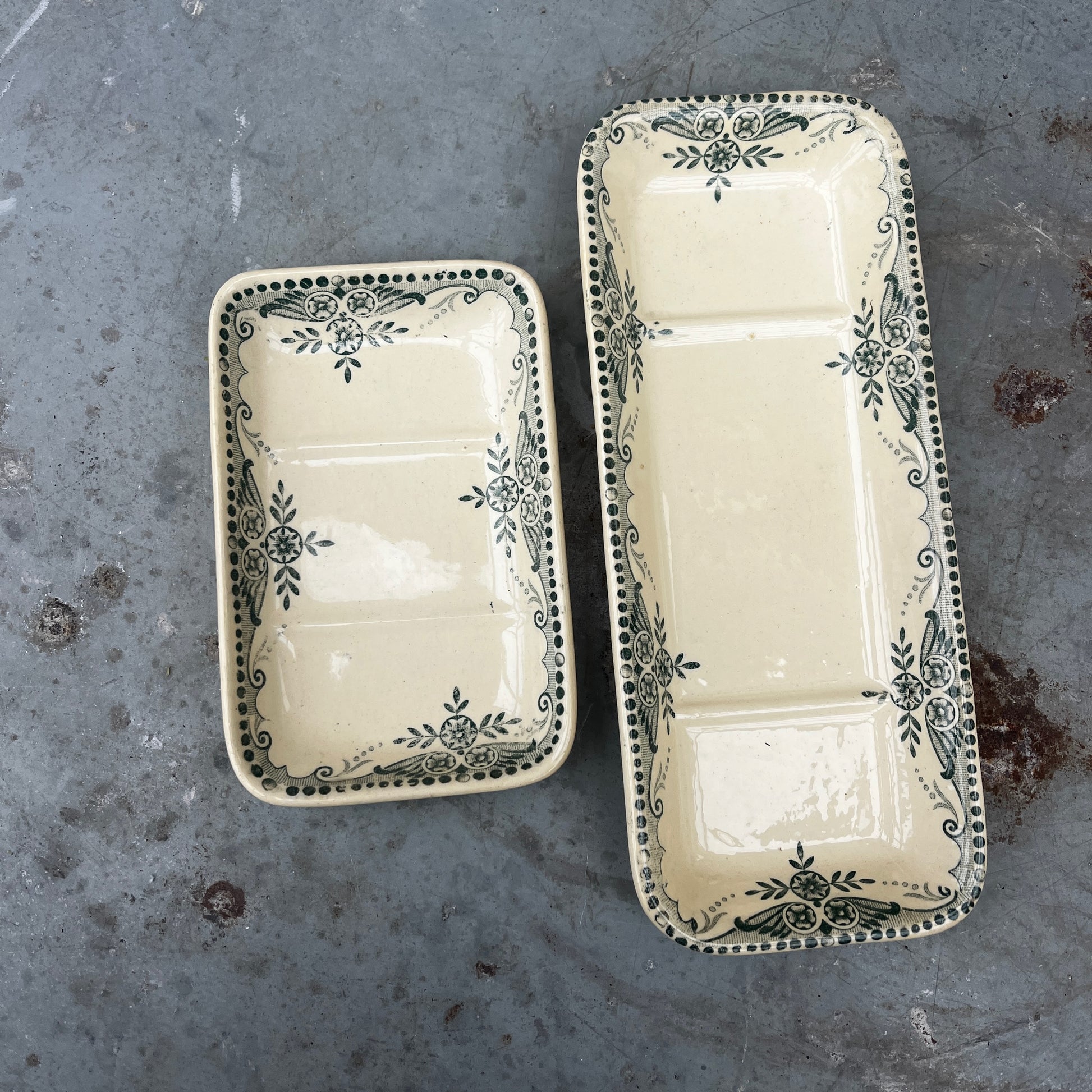 Antique French wash set in green and cream Terre de Fer pottery, stamped HB & Cie Massena, including a basin and jug with classic transferware decoration