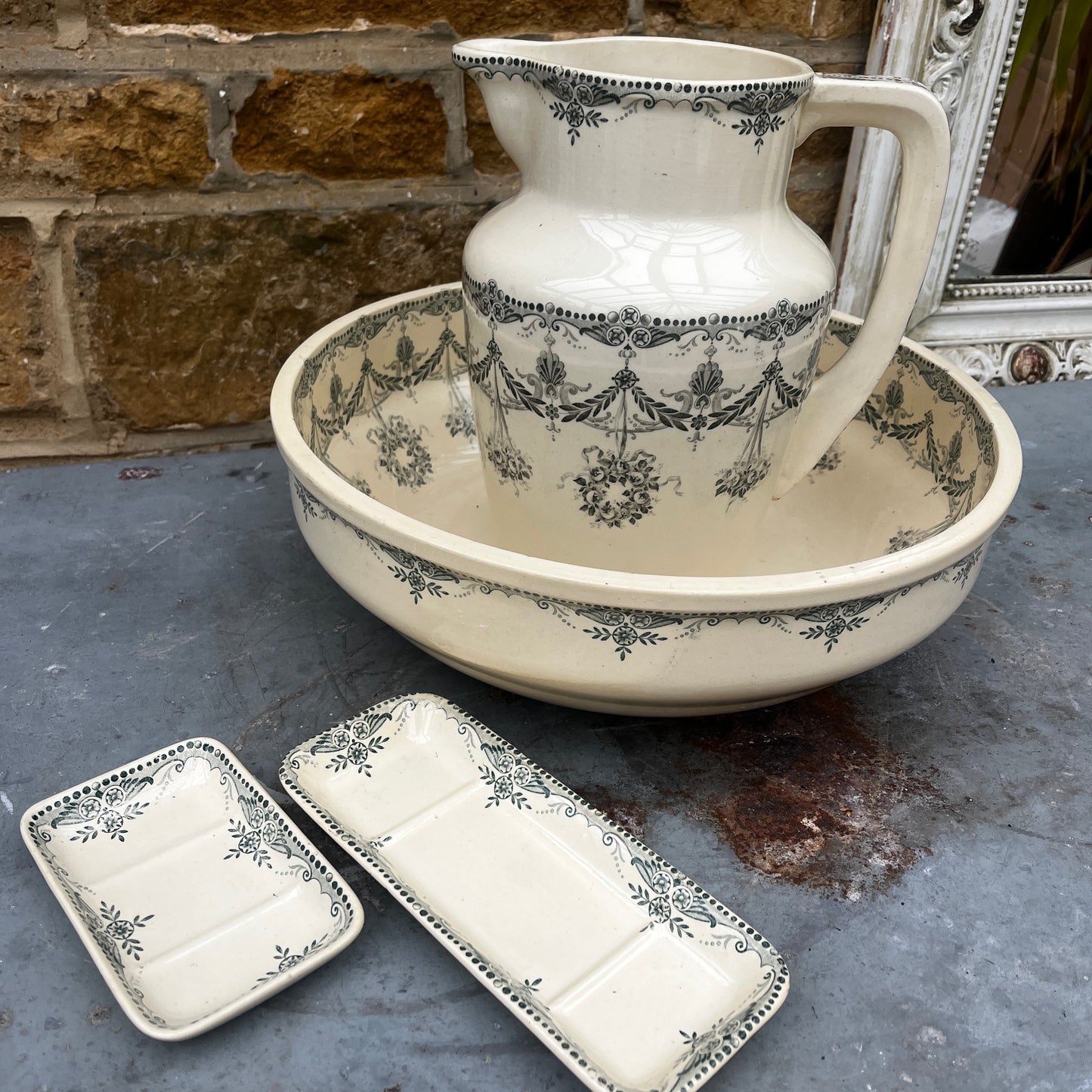 Antique French wash set in green and cream Terre de Fer pottery, stamped HB & Cie Massena, including a basin and jug with classic transferware decoration