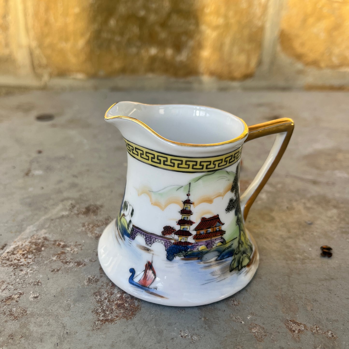 Vintage Japanese coffee / tea set by Noritake, crafted from fine porcelain with gilded accents. The set includes cups, saucers, sugar bowl, milk jug and a teapot, featuring delicate hand-painted designs and a classic, elegant finish.