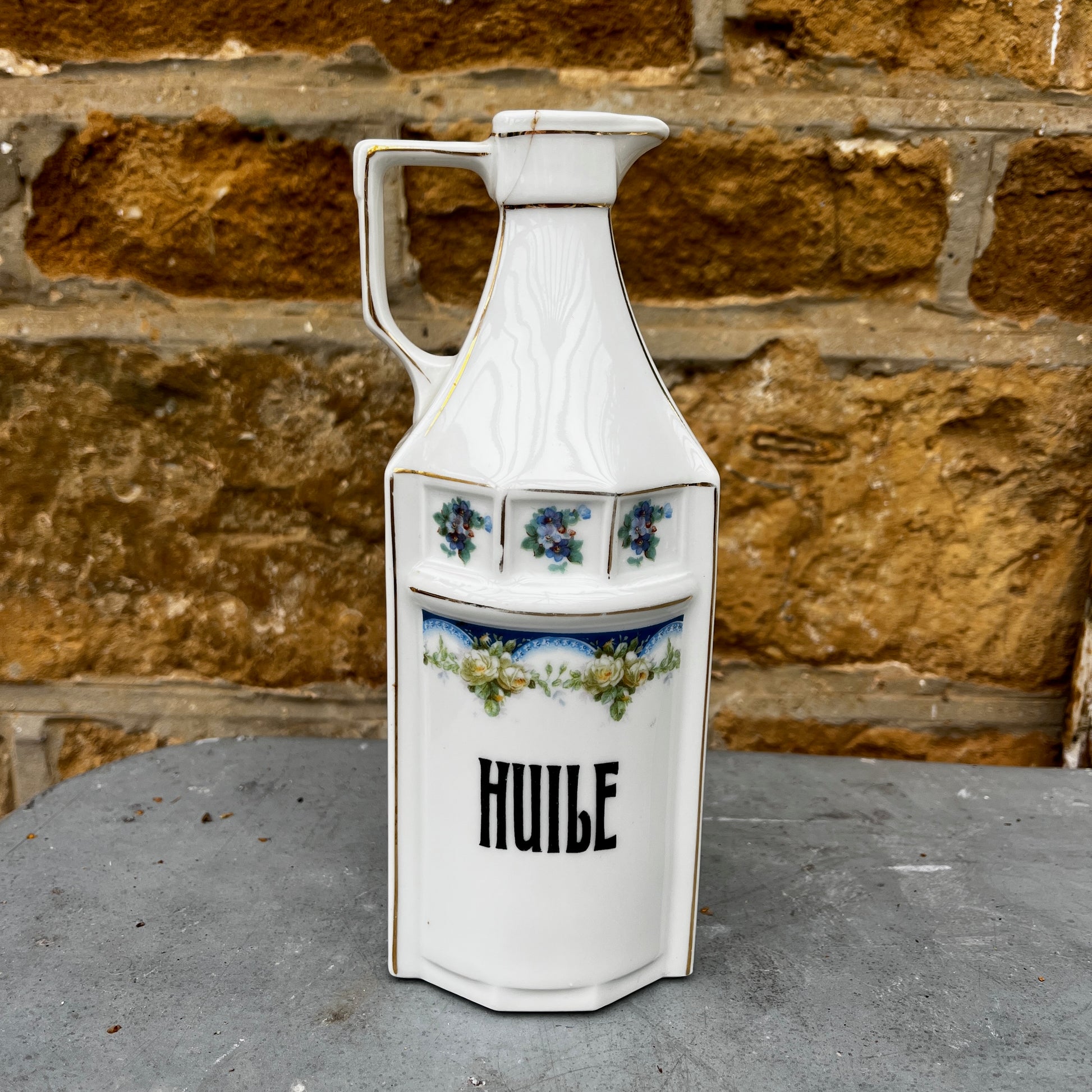 French kitchen storage canisters in white porcelain with blue, green & yellow decorative detailing. The canisters feature classic shapes, hand-painted motifs, and a timeless vintage French country style.
