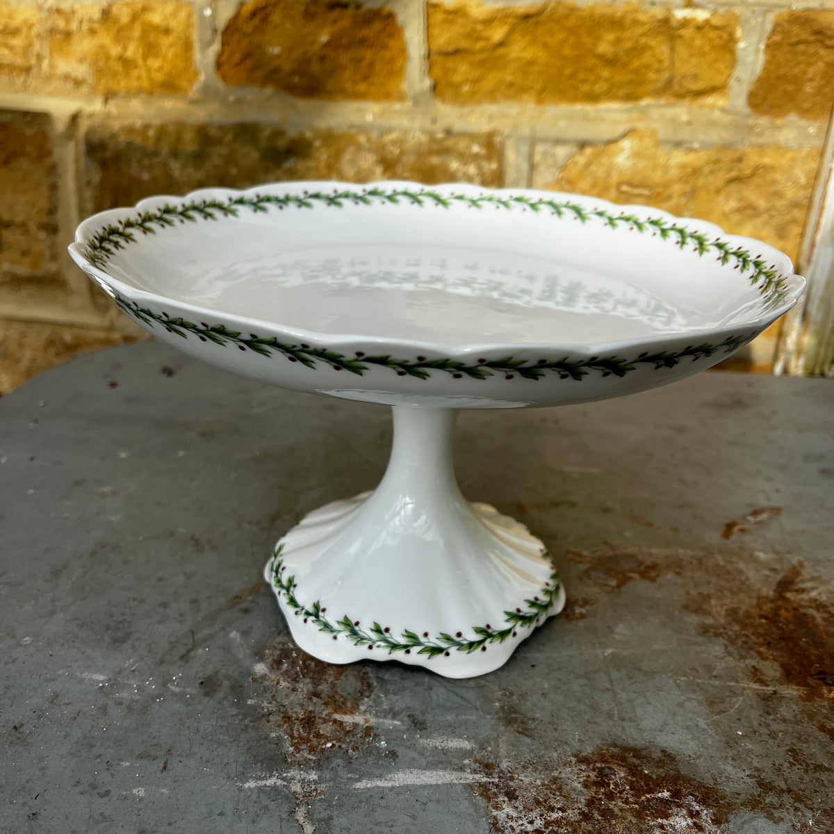 Vintage Limoges porcelain tea set featuring delicate green garland decoration around the rims of the pieces