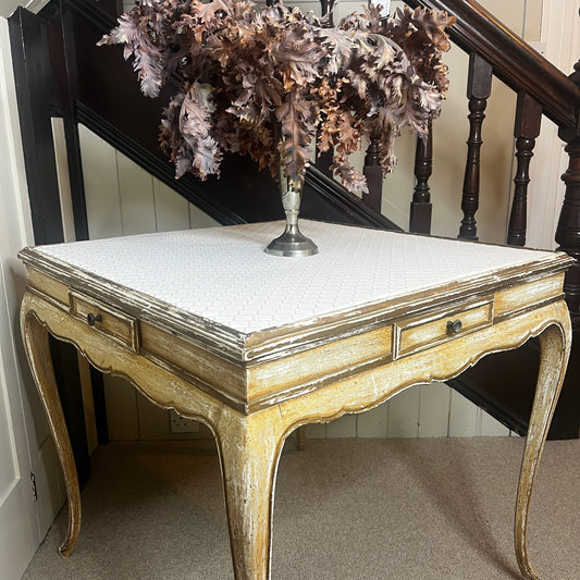 Square Louis-Philippe–style table with a warm wood finish, featuring clean classical lines, gently rounded edges, and small drawers built into all four sides, supported by four turned legs.

