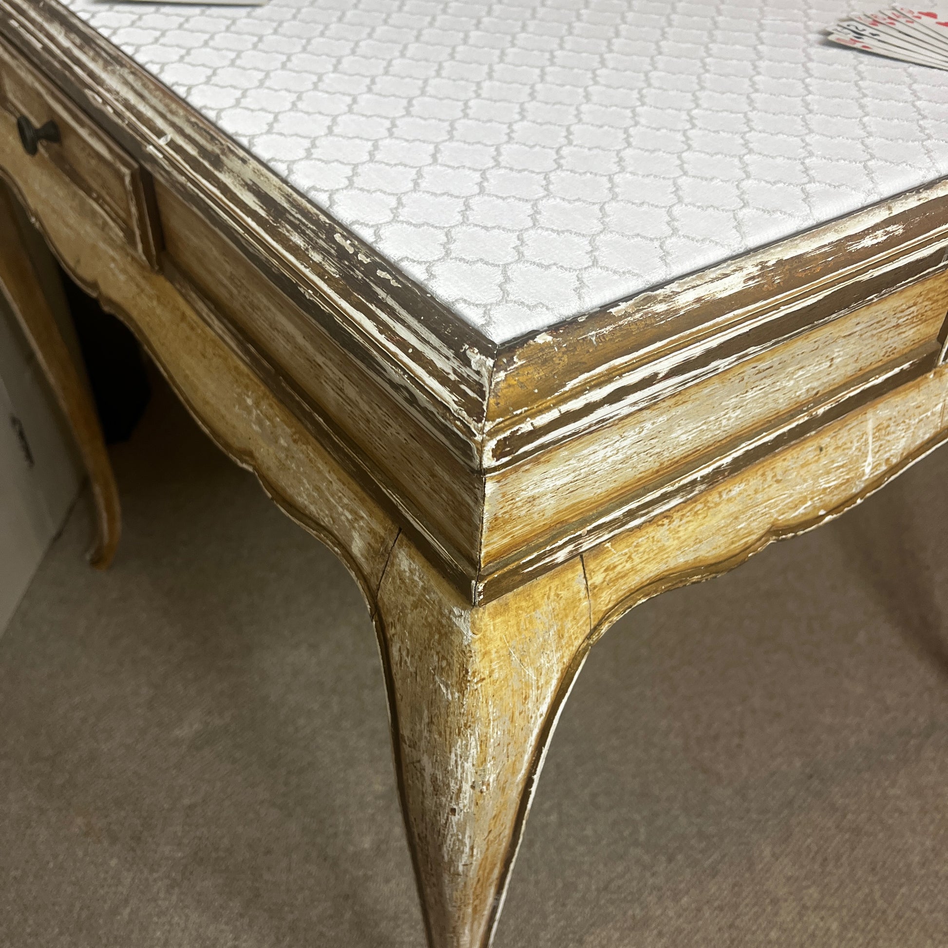 Square Louis-Philippe–style table with a warm wood finish, featuring clean classical lines, gently rounded edges, and small drawers built into all four sides, supported by four turned legs.
