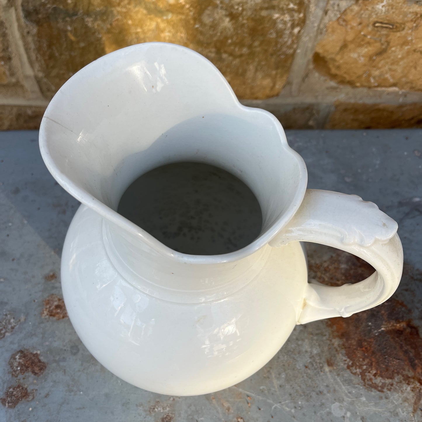 Large ceramic jug from Maastricht, featuring a sturdy handle, rounded body, and traditional glazed finish with classic Dutch pottery styling.