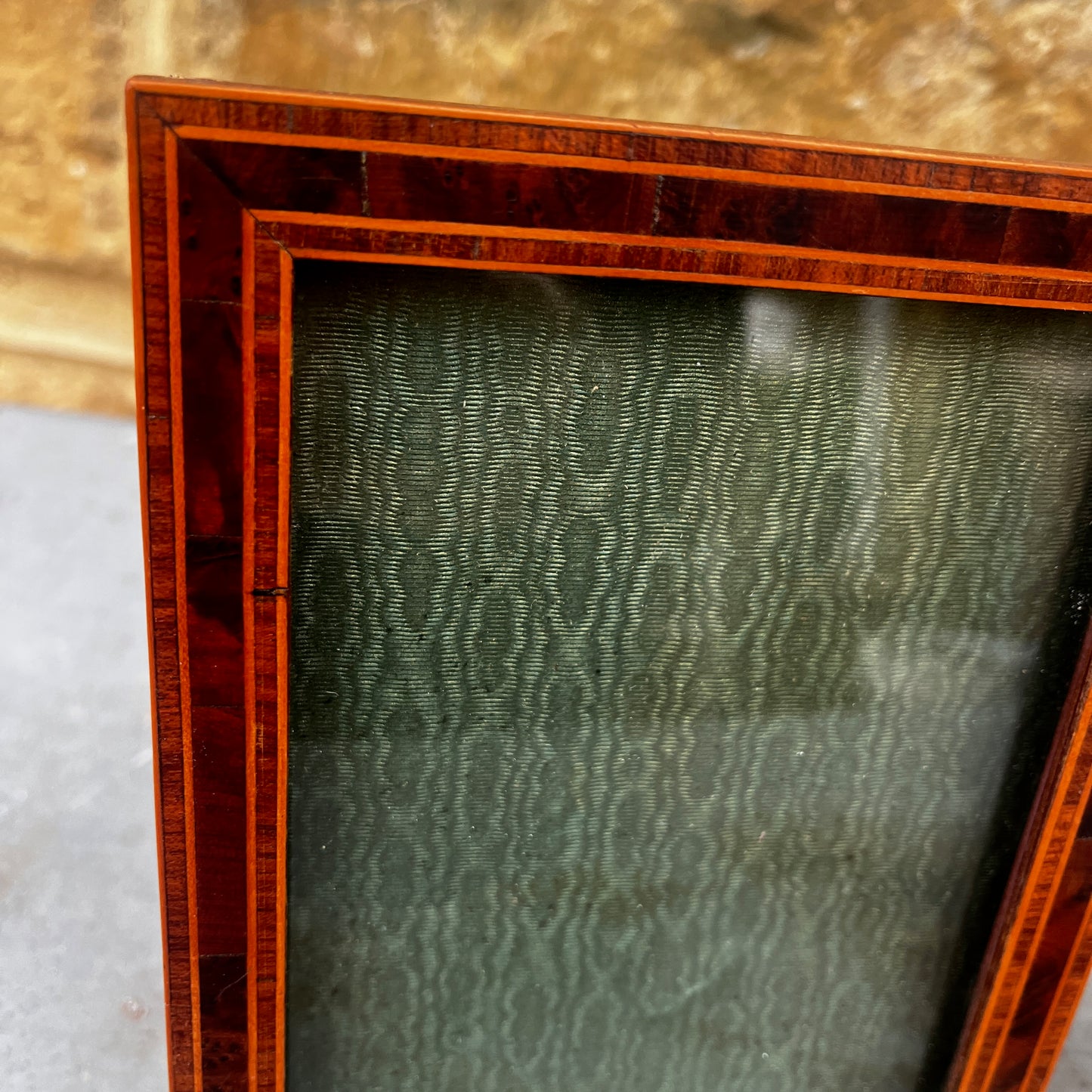 Pair of vintage marquetry picture frames featuring decorative inlaid wood patterns and a warm, polished finish.