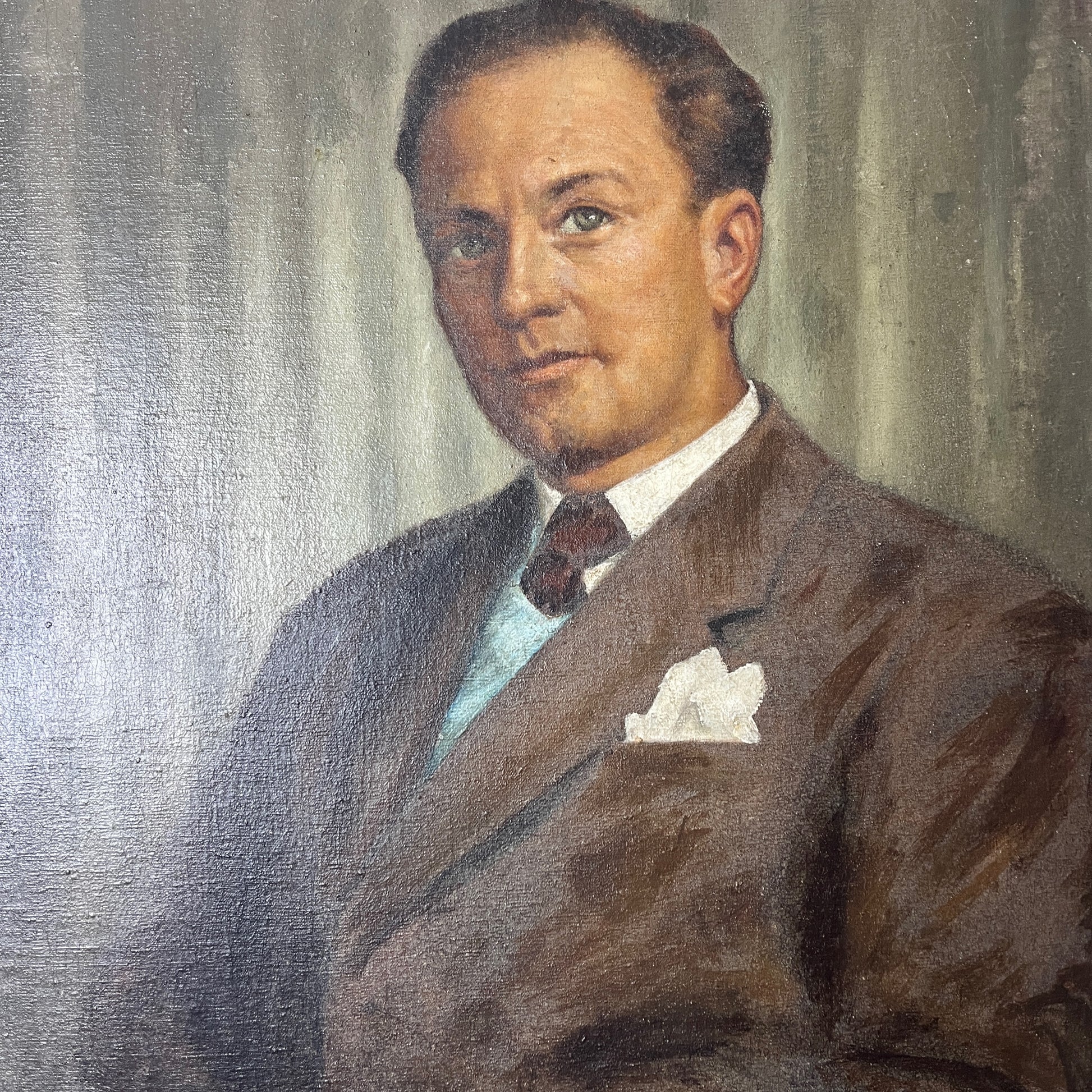 Framed oil on board portrait of a gentleman, signed by the artist. The painting depicts the subject in traditional attire with detailed facial features and a muted background, presented in a classic frame.