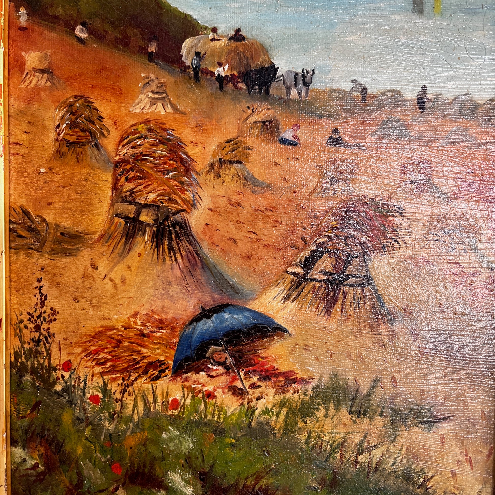 A vintage oil painting on canvas depicting a tranquil coastal scene with blue water, a sandy shoreline, and distant cliffs or headland beneath a softly painted sky. The atmospheric landscape is presented in an ornate gold-coloured frame, adding a classic, elegant touch to the artwork