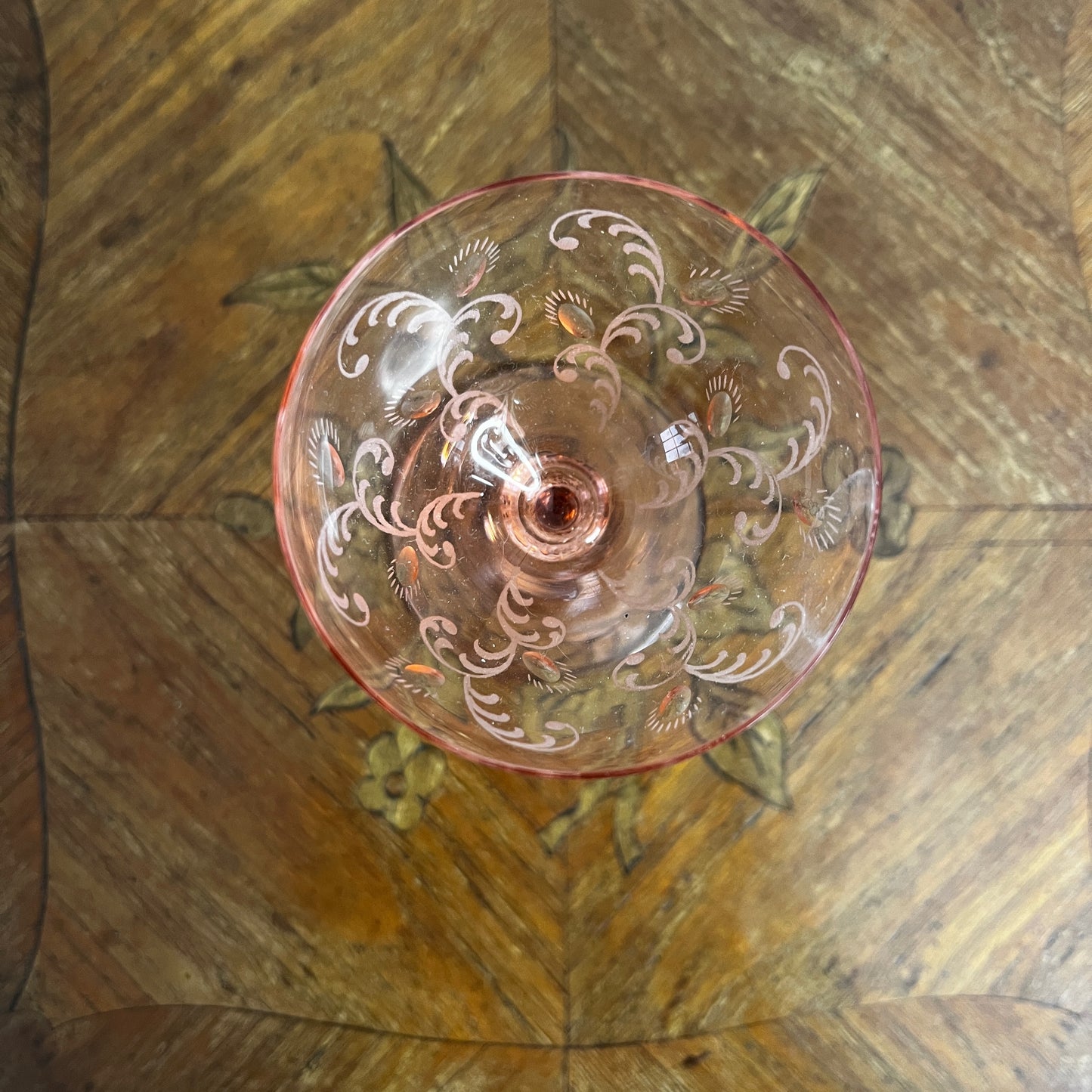Blush pink depression glass coupes with a delicate, translucent finish. The shallow, rounded bowls feature vintage 1930s design, showcasing elegant, soft pastel tones.