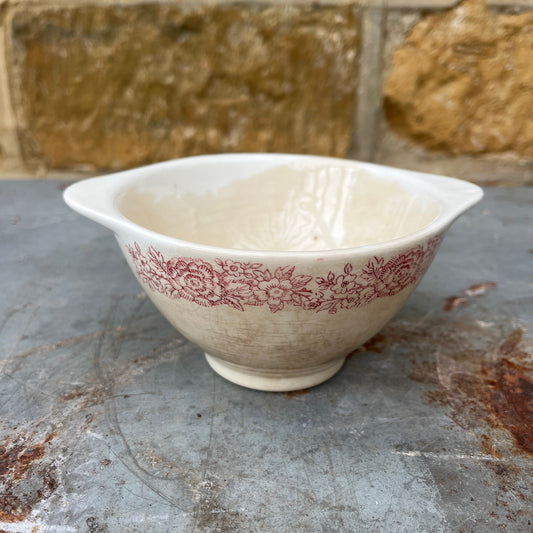 Vintage French bowl with delicate rose detailing, featuring a classic decorative design and softly aged ceramic finish.
