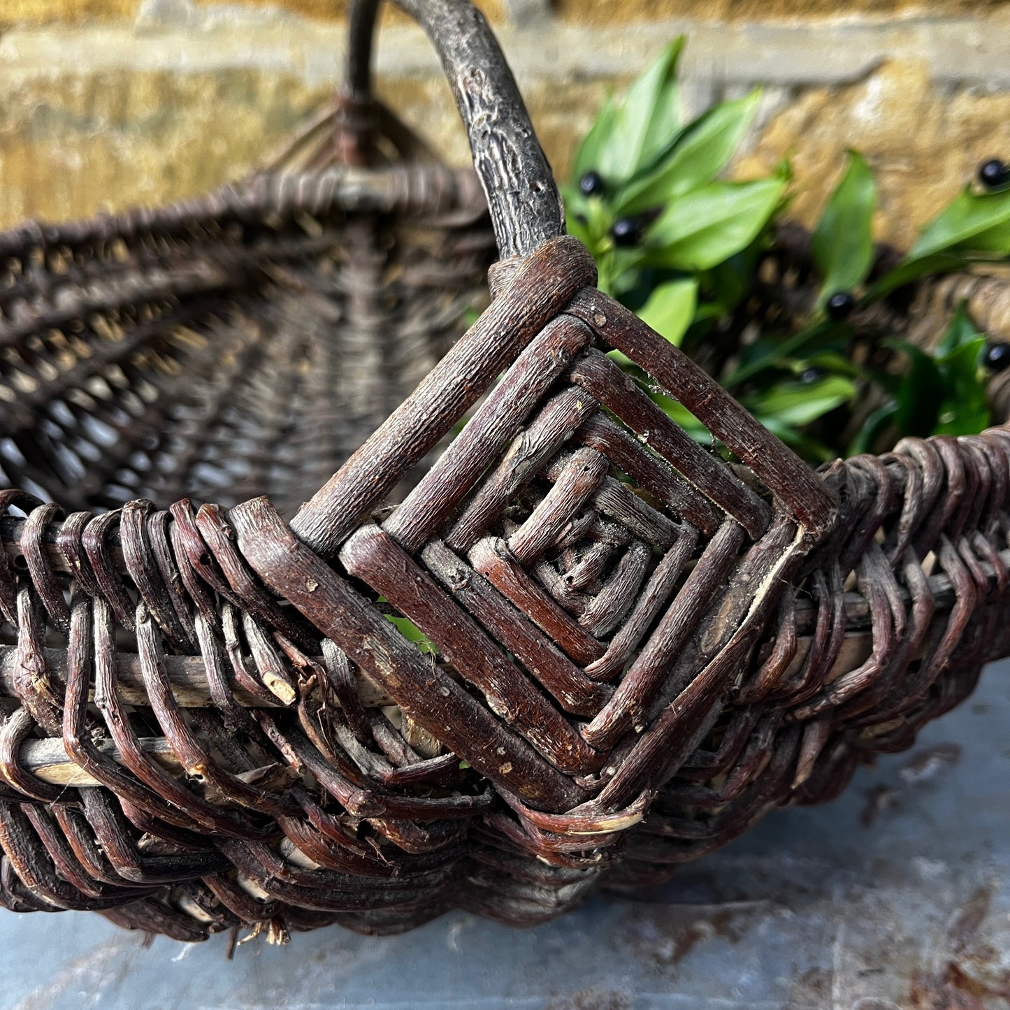 Rustic French wicker baskets with hand-woven construction and a natural, weathered finish. The baskets feature sturdy handles and textured surfaces, reflecting traditional French country craftsmanship.