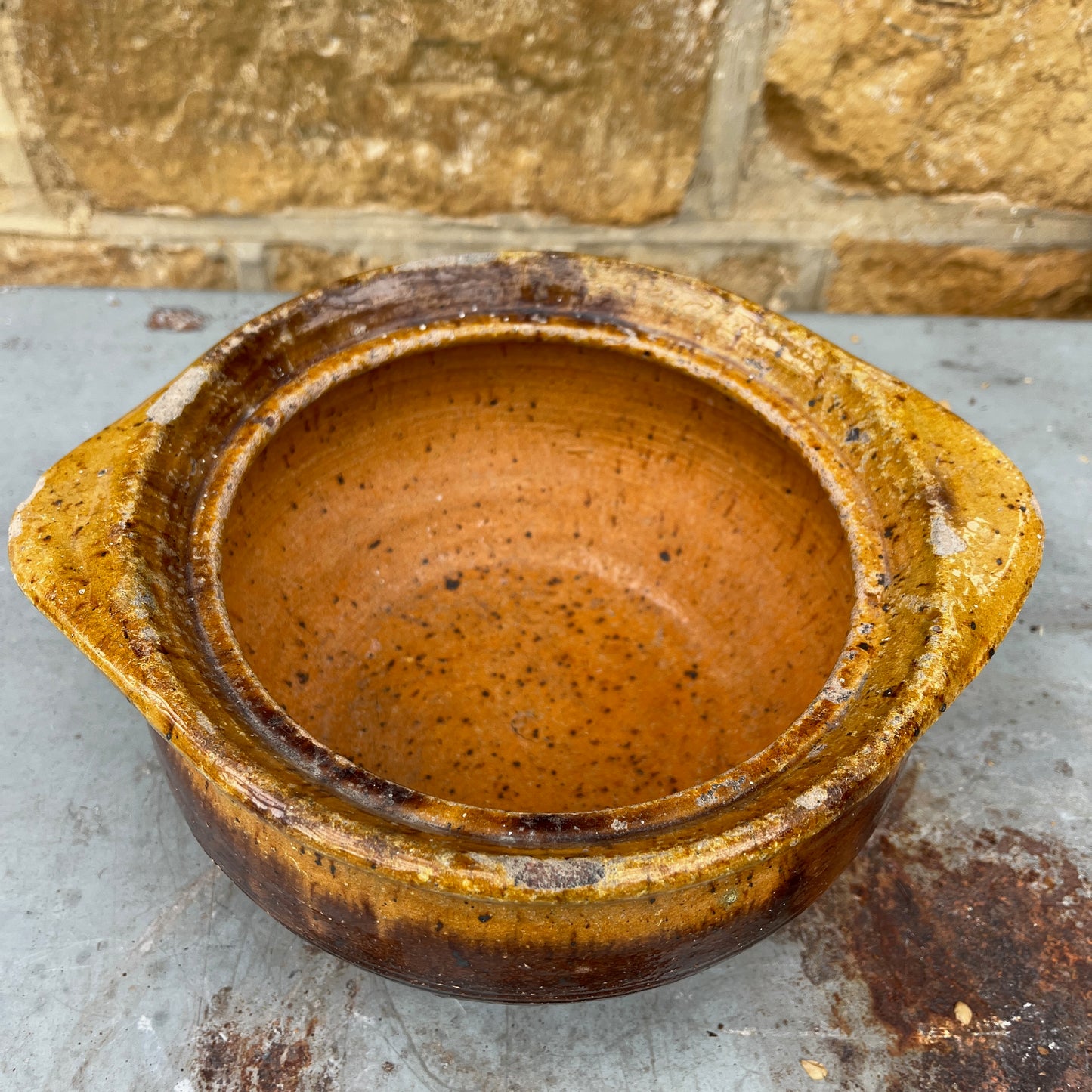 A Rustic, Glazed Redware Pot With Mottled Brown and Amber Colouration