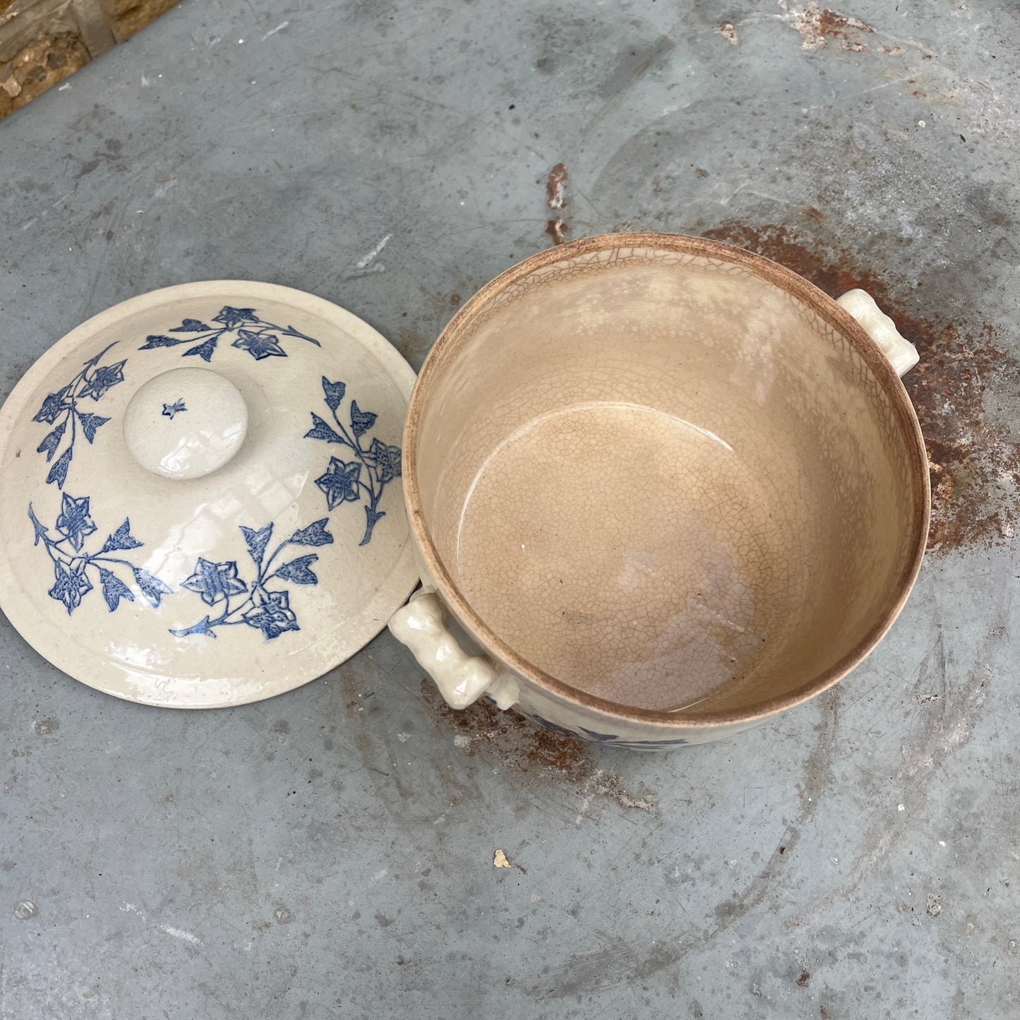 An antique French Saint-Uze lidded tureen in classic blue and white stoneware, decorated with traditional floral transferware patterns.