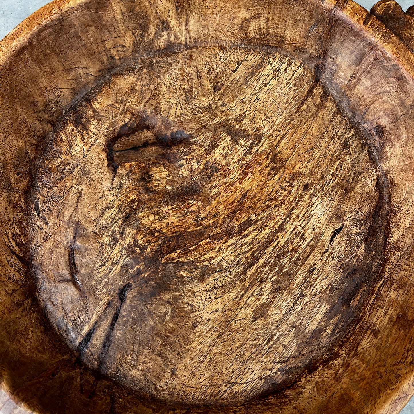 Rustic Hand-carved Wooden Bowl with a Decorative Handle
