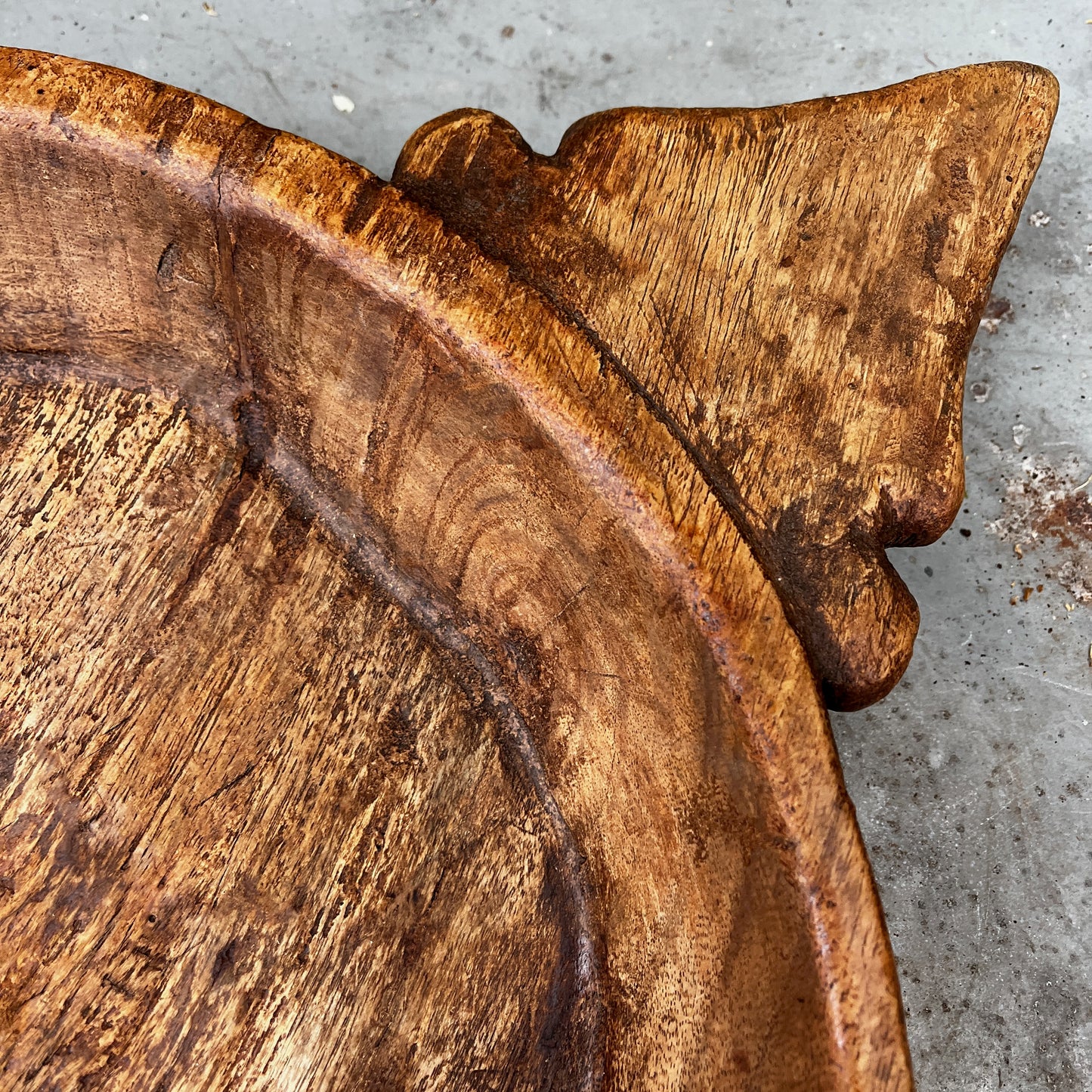 Rustic Hand-carved Wooden Bowl with a Decorative Handle