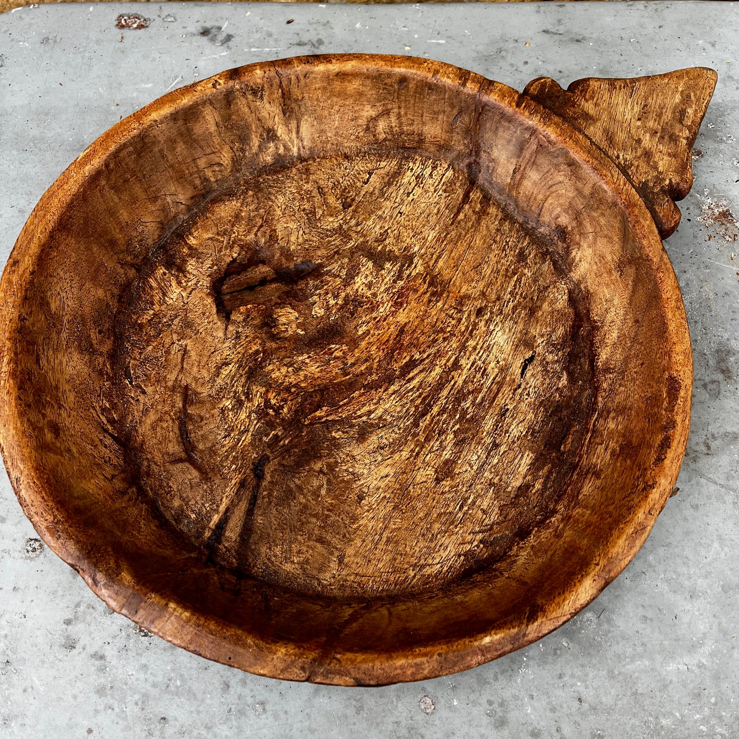 Rustic Hand-carved Wooden Bowl with a Decorative Handle