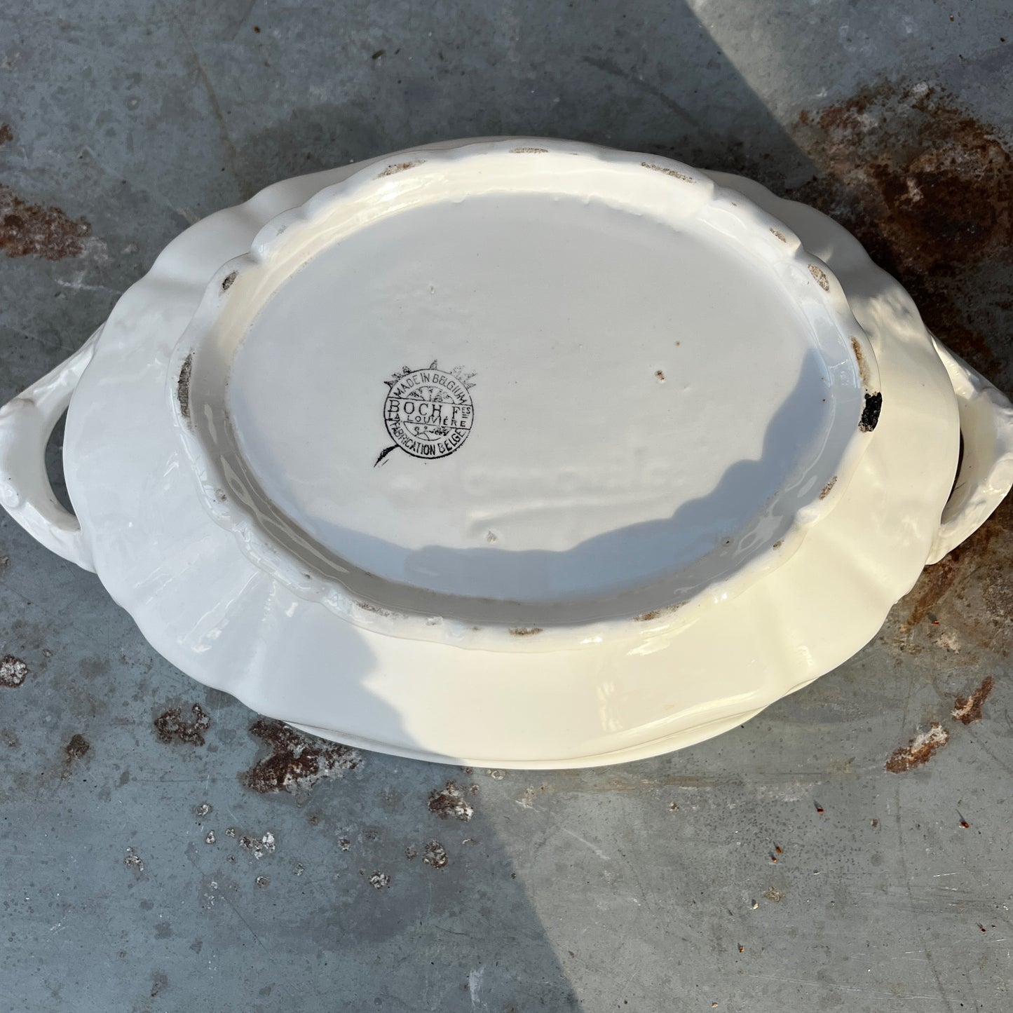 Vintage Belgian soup tureen with lid and matching ladle, featuring unusual white ceramic design and a traditional glazed finish.