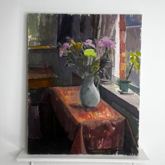An original still-life oil on canvas by Claire Randell featuring a carefully arranged composition of flowers in a vase next to a window.
