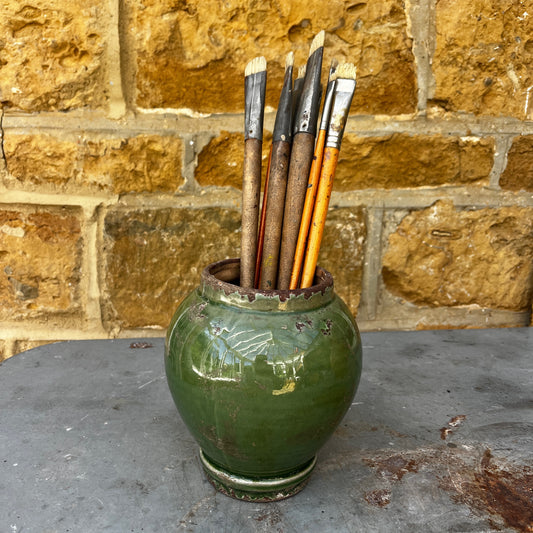 A vintage Sung-style Oriental vase with a soft green celadon glaze and an elegant, understated silhouette