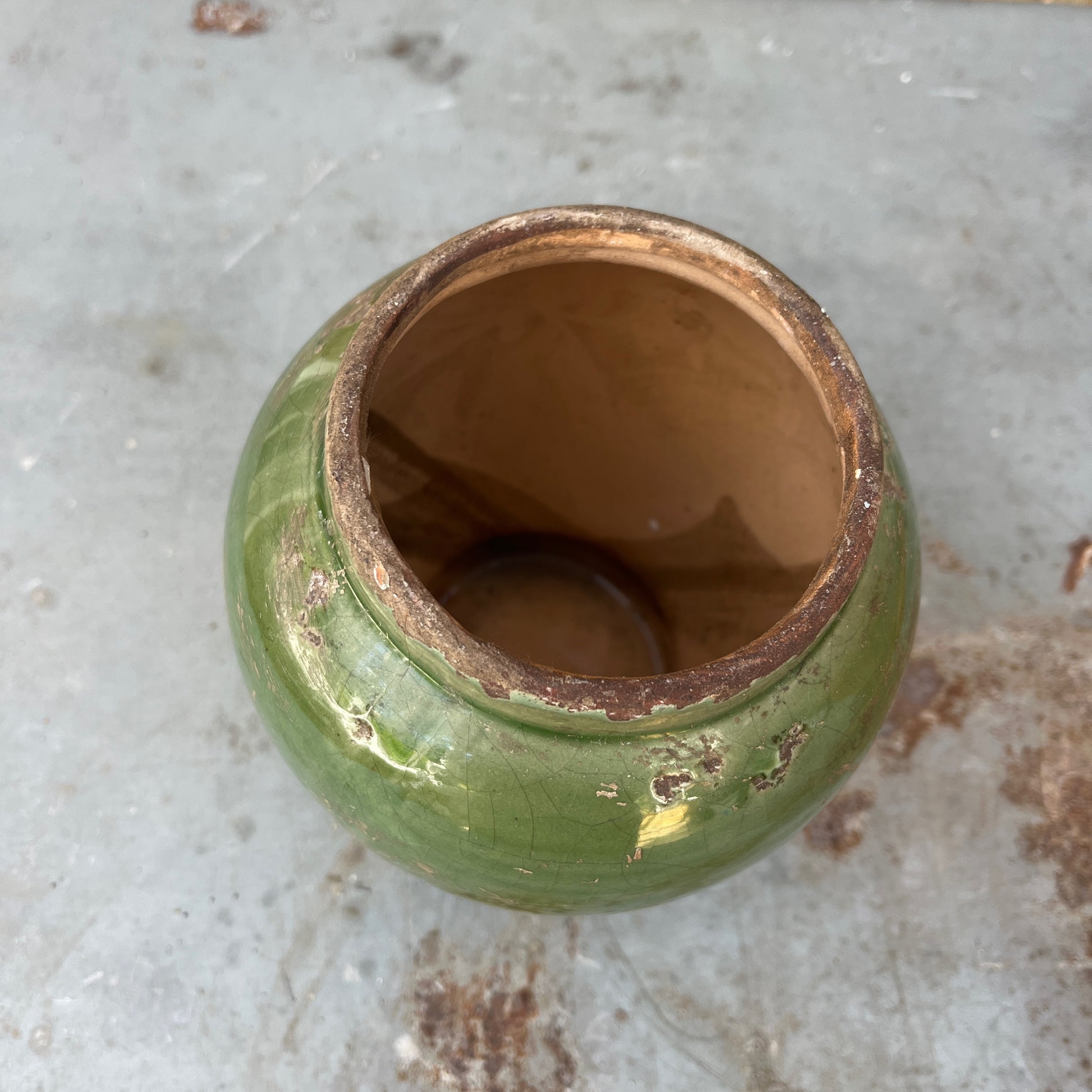 A vintage Sung-style Oriental vase with a soft green celadon glaze and an elegant, understated silhouette