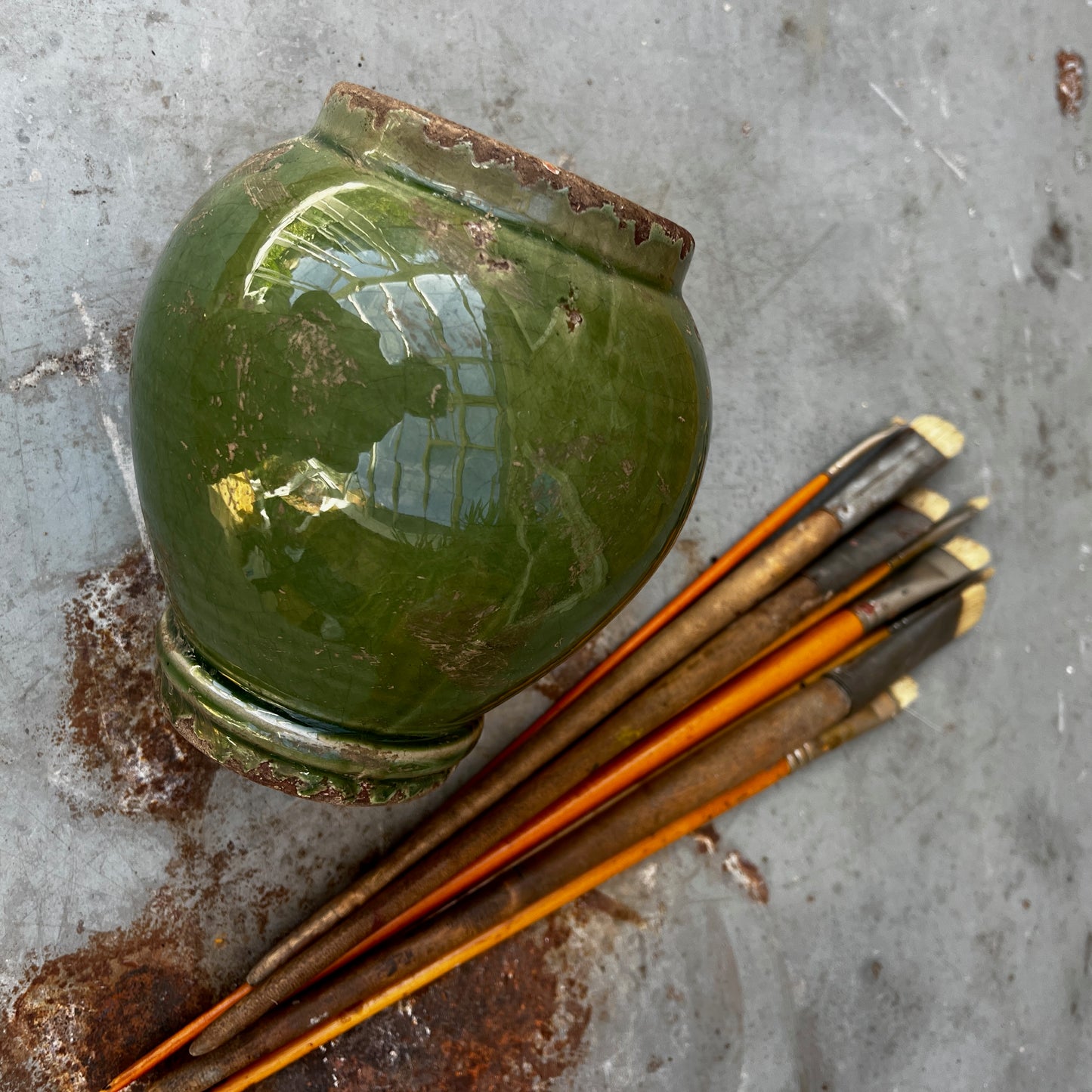 A vintage Sung-style Oriental vase with a soft green celadon glaze and an elegant, understated silhouette