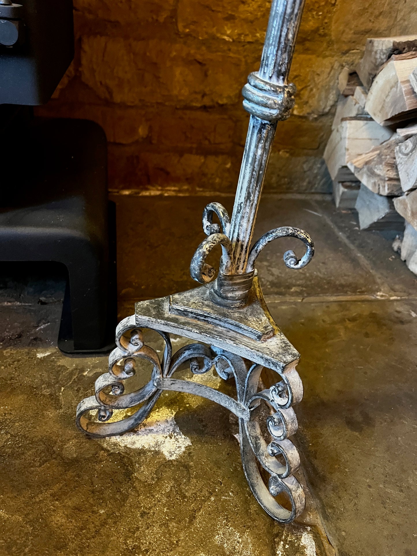 Vintage French tall metal candelabra in grey, featuring a single candle holder and a slender, elegant silhouette with a distressed aged finish.