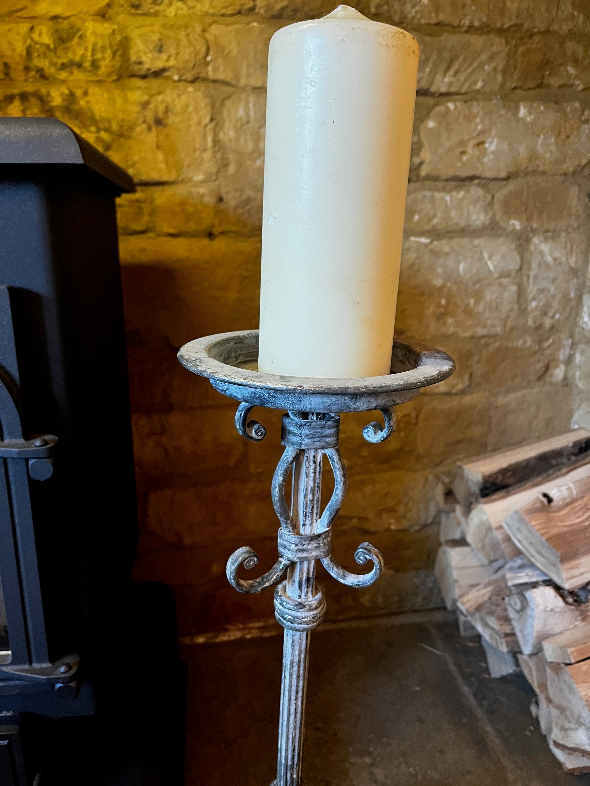 Vintage French tall metal candelabra in grey, featuring a single candle holder and a slender, elegant silhouette with a distressed aged finish.