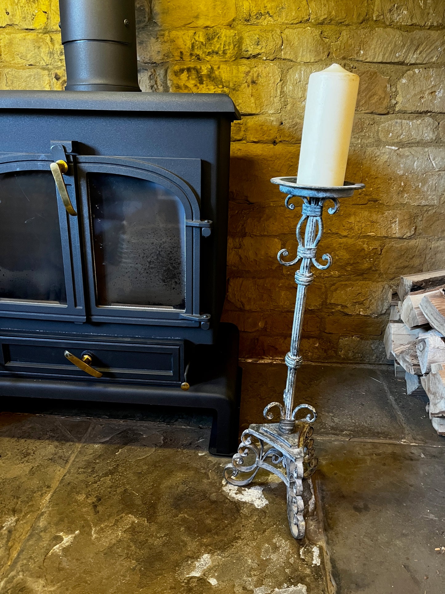 Vintage French tall metal candelabra in grey, featuring a single candle holder and a slender, elegant silhouette with a distressed aged finish.
