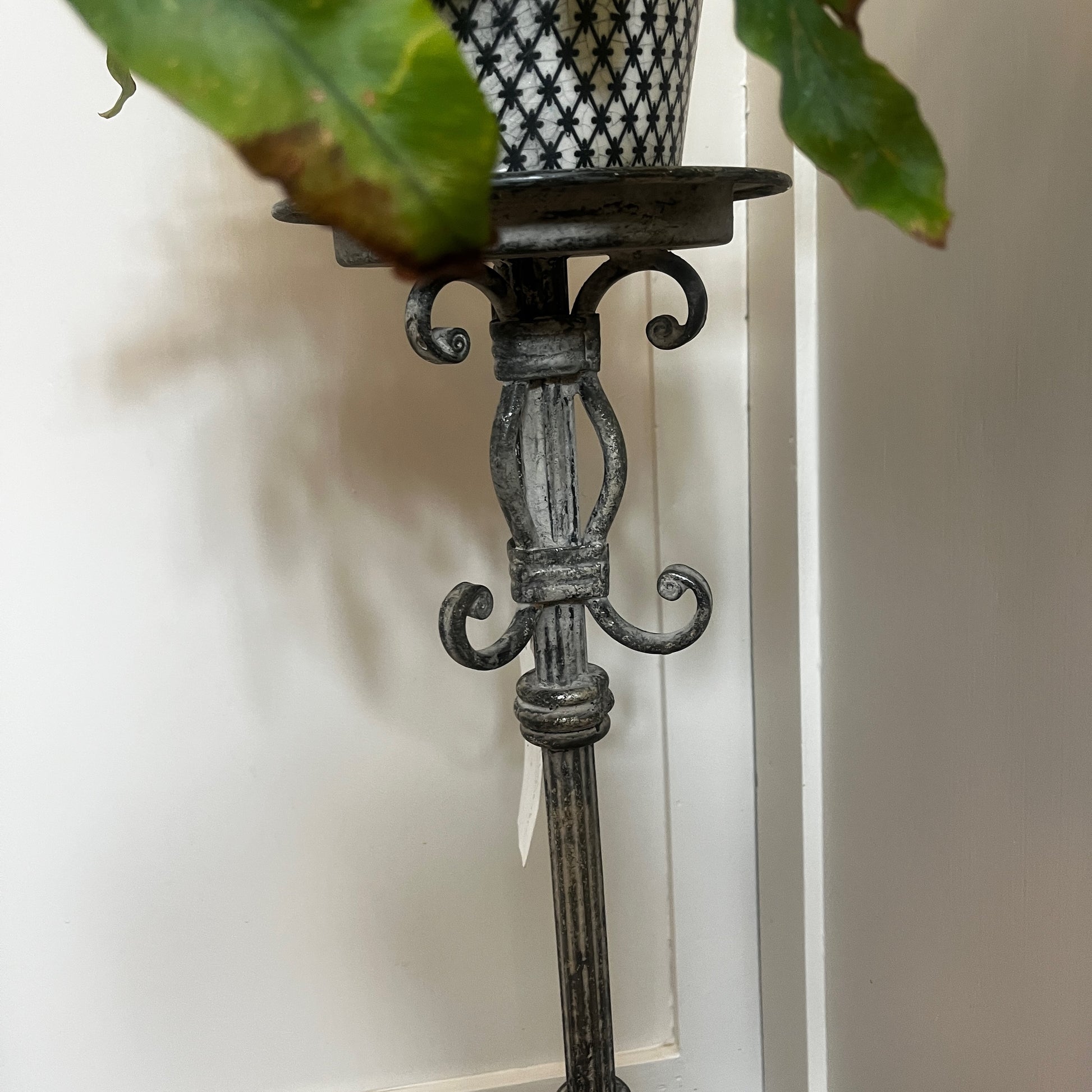 Vintage French tall metal candelabra in grey, featuring a single candle holder and a slender, elegant silhouette with a distressed aged finish.