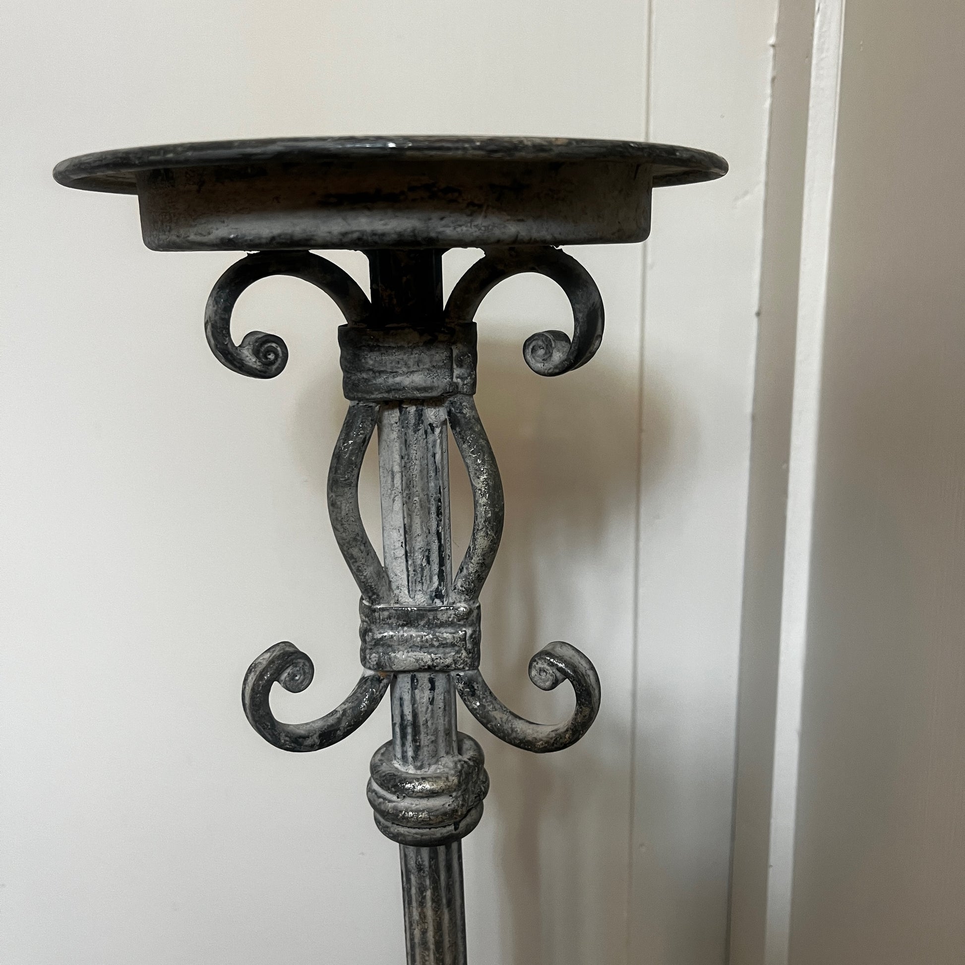 Vintage French tall metal candelabra in grey, featuring a single candle holder and a slender, elegant silhouette with a distressed aged finish.