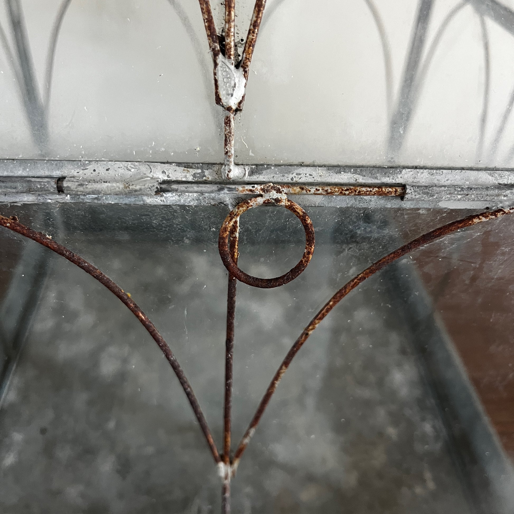 Vintage-style glass terrarium with a decorative frame and classic antique-inspired design