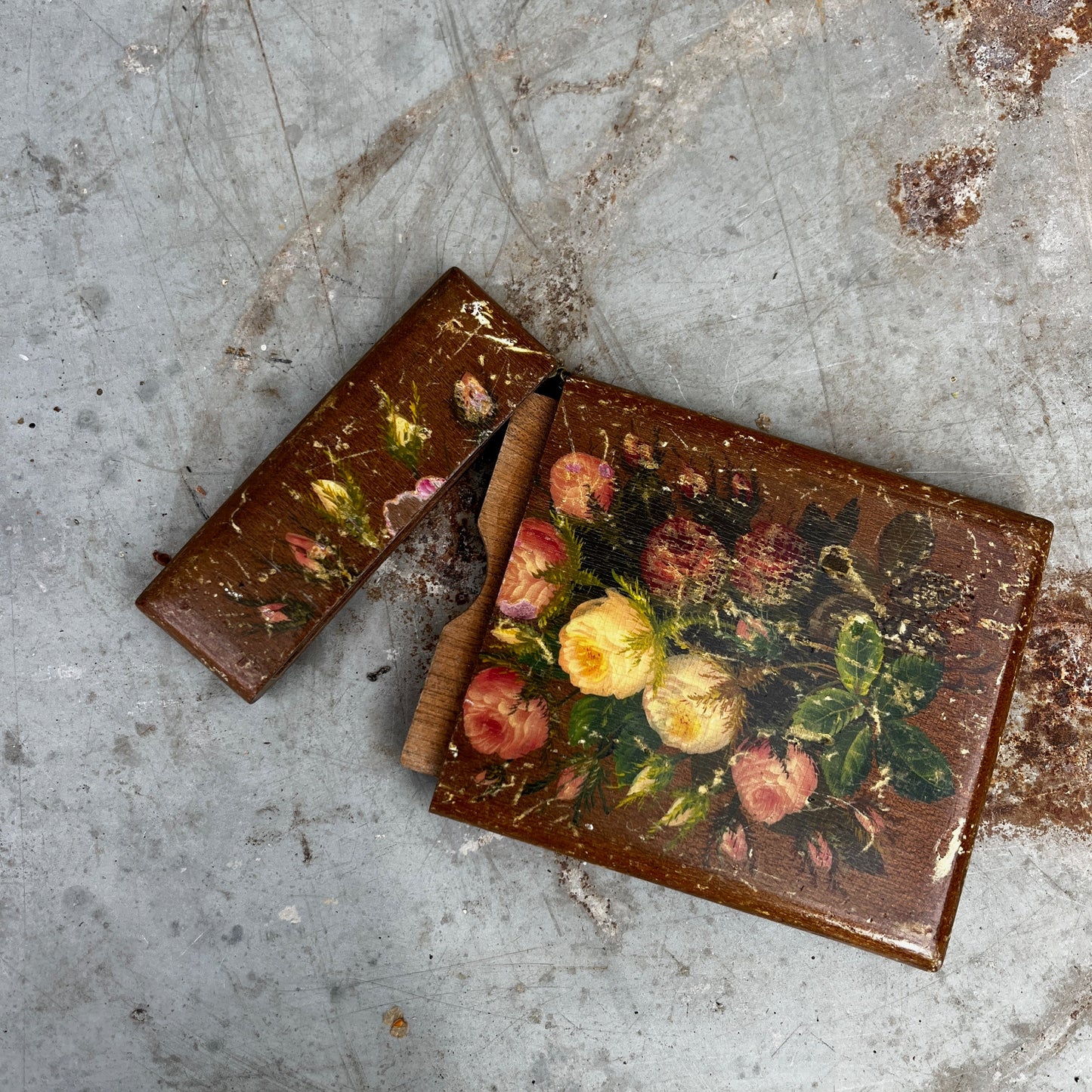 A small vintage wooden toleware box designed to hold business cards, featuring a hand-painted finish and decorative floral motifs. The rectangular box has a hinged lid and a gently aged patina