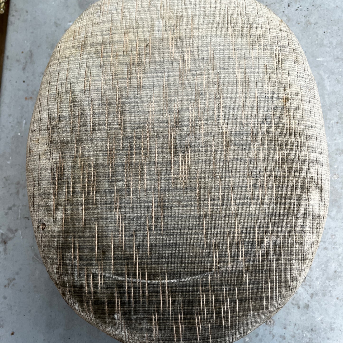 Decorative stool with textured cushion and wooden legs 