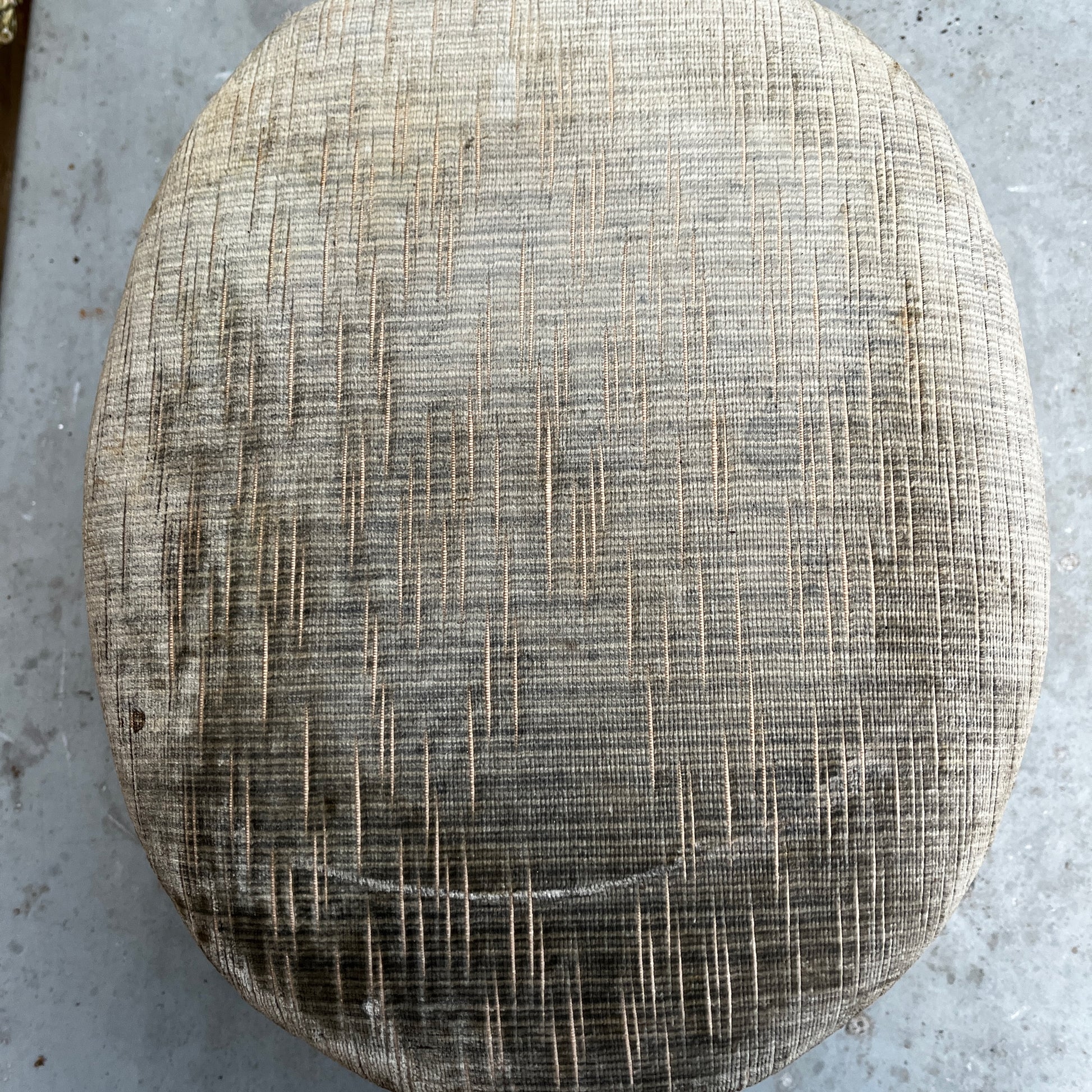Decorative stool with textured cushion and wooden legs 