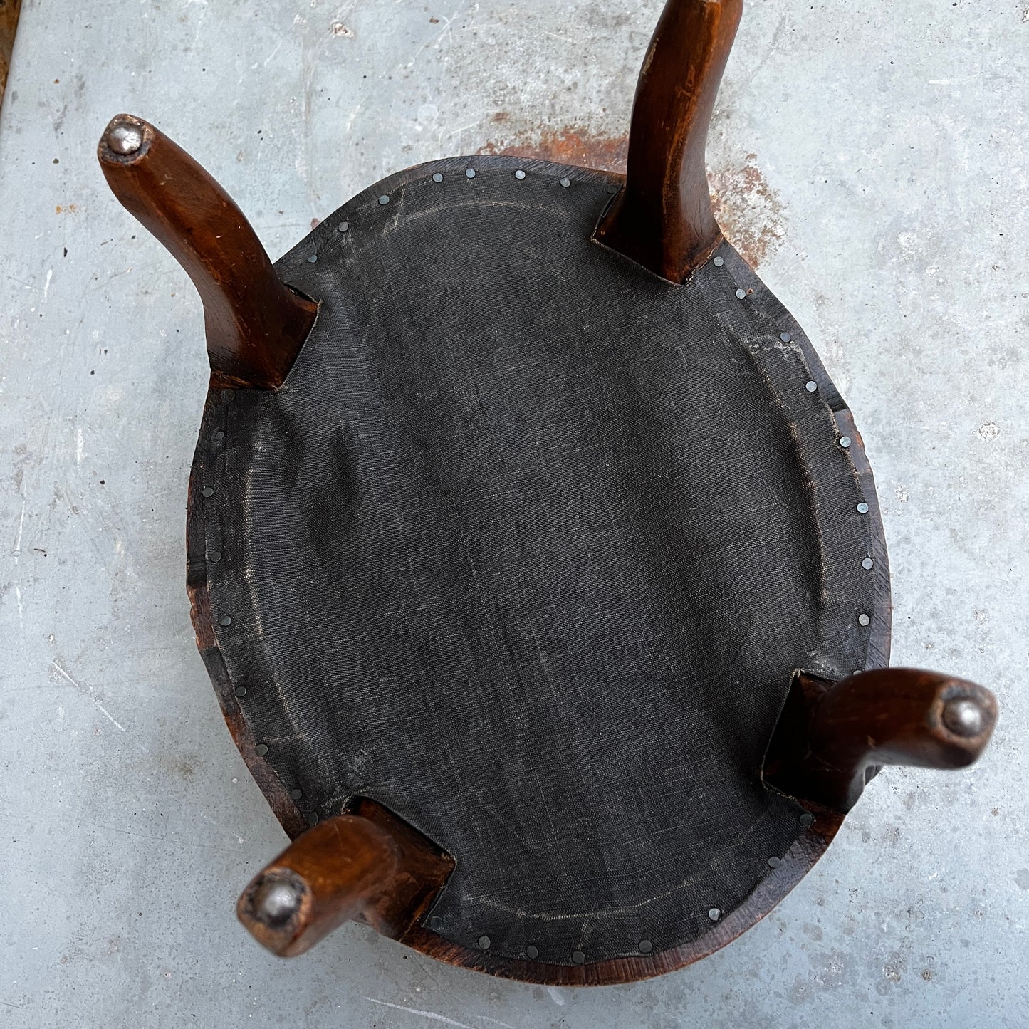 Decorative stool with textured cushion and wooden legs 