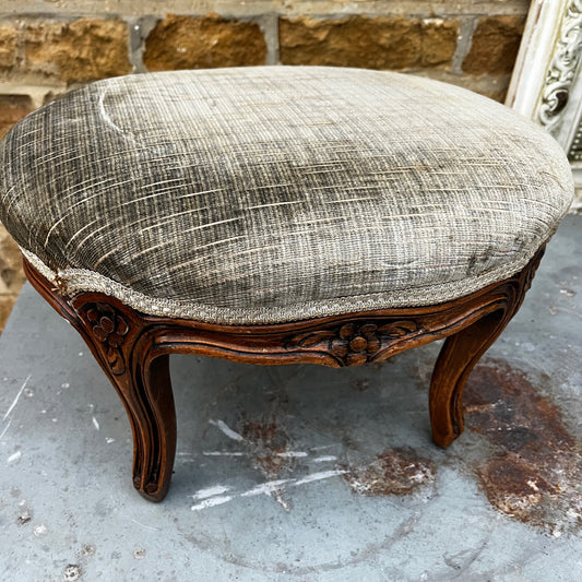 Decorative stool with textured cushion and wooden legs 