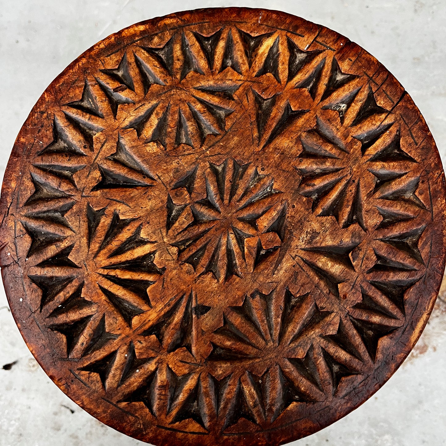 Vintage wooden stool with intricate carvings